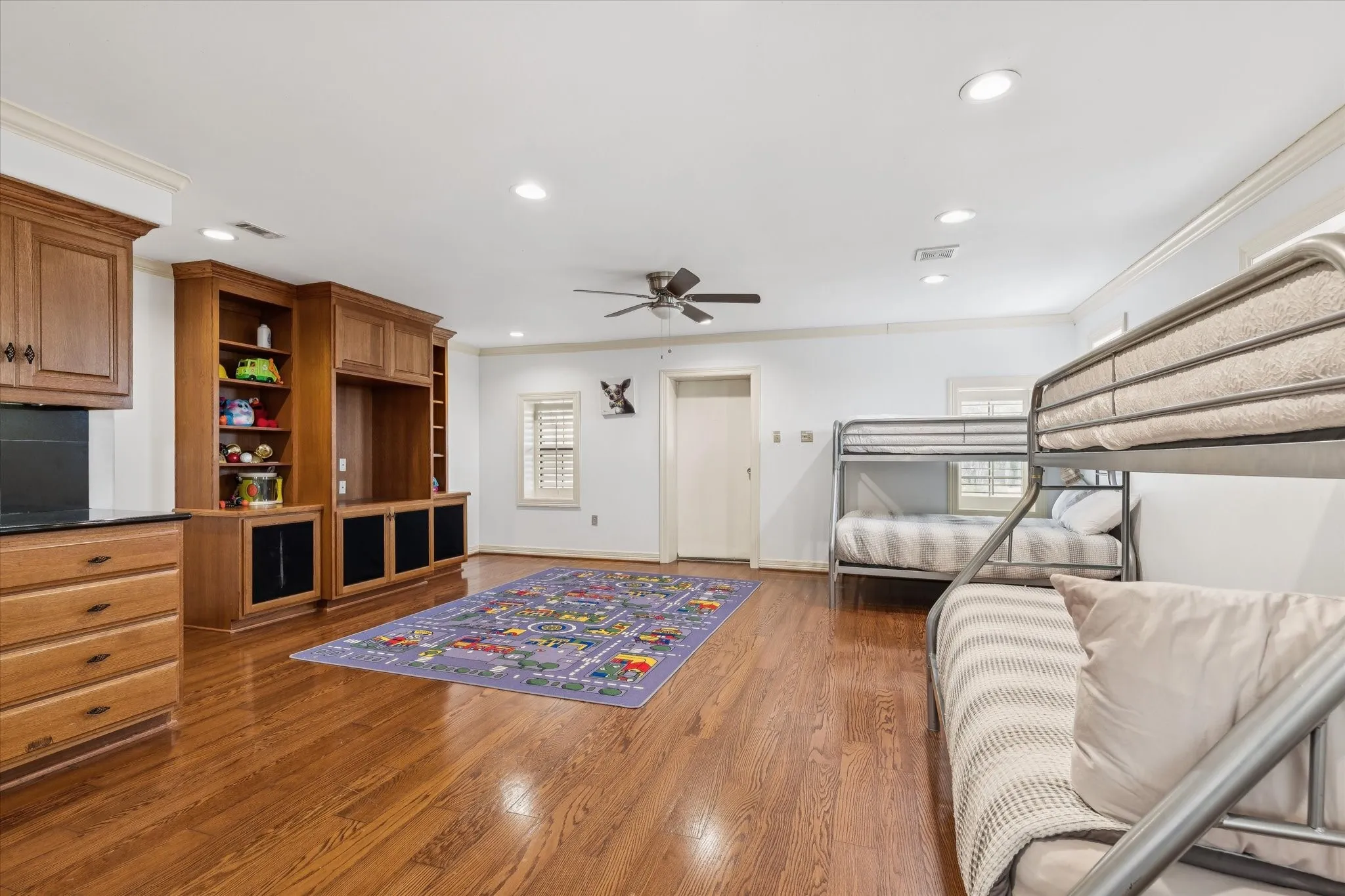 Bedroom with crown molding, recessed lighting, dark wood finished floors, and ceiling fan
