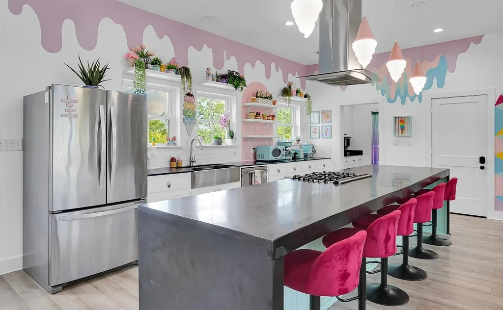 Kitchen featuring stainless steel appliances, island exhaust hood, light wood finished floors, a kitchen island, and recessed lighting