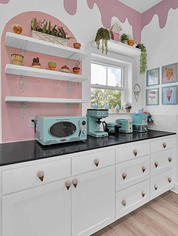 Kitchen featuring open shelves, white cabinetry, and light wood finished floors