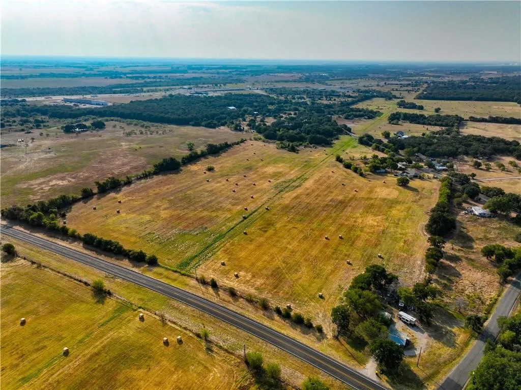 Aerial view of property and surrounding area with rural landscape