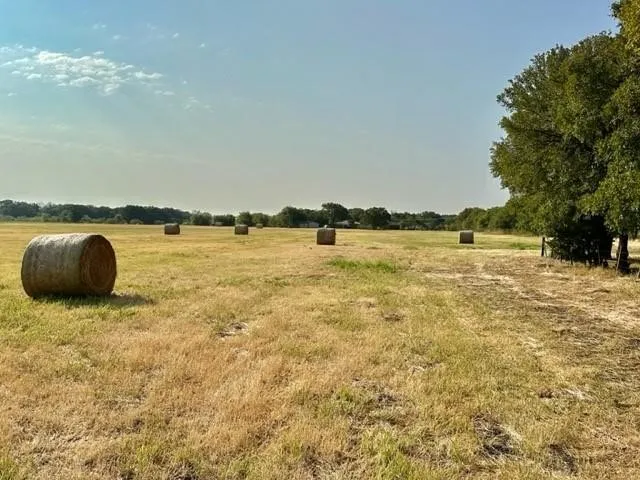 View of grassy yard featuring a view of rural / pastoral area
