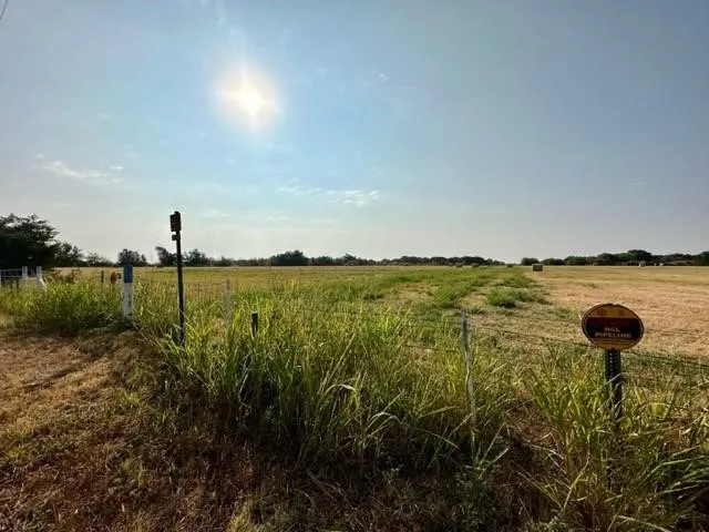 View of yard with a rural view