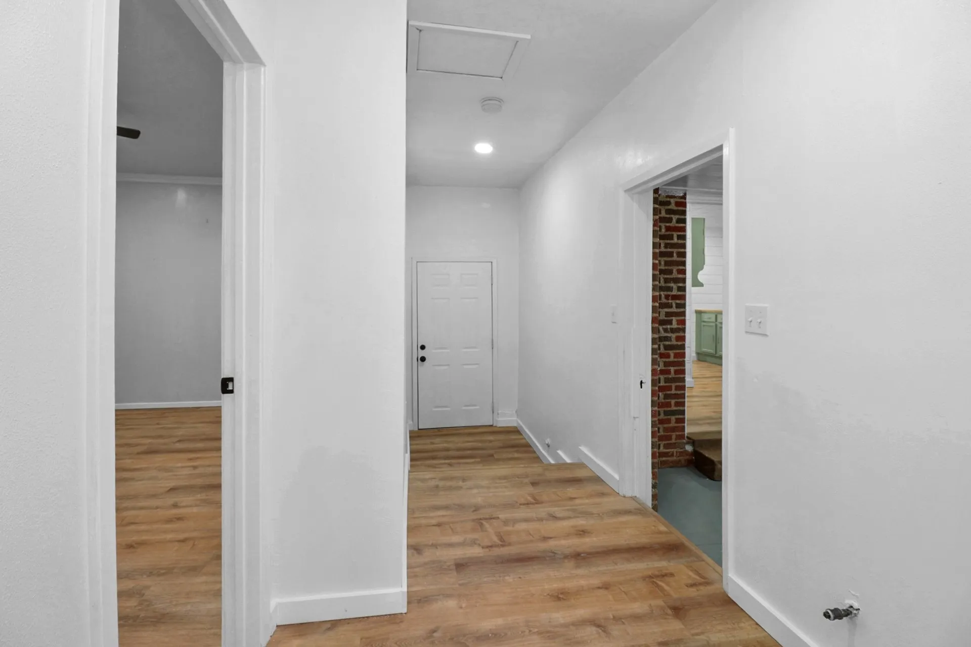 Hallway in Master Bedroom Suite with entry door to carport