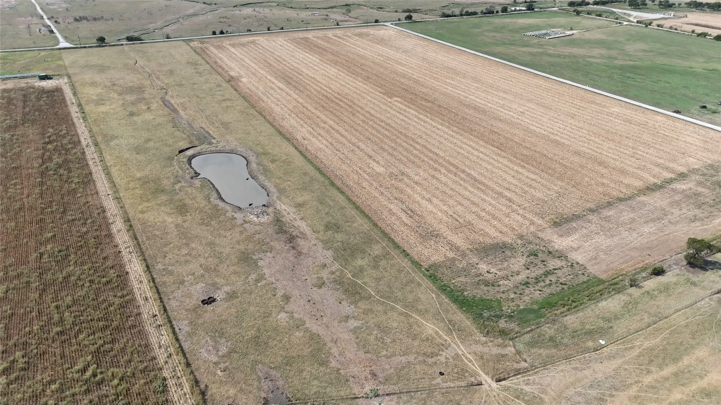 Aerial view of sparsely populated area with farmland