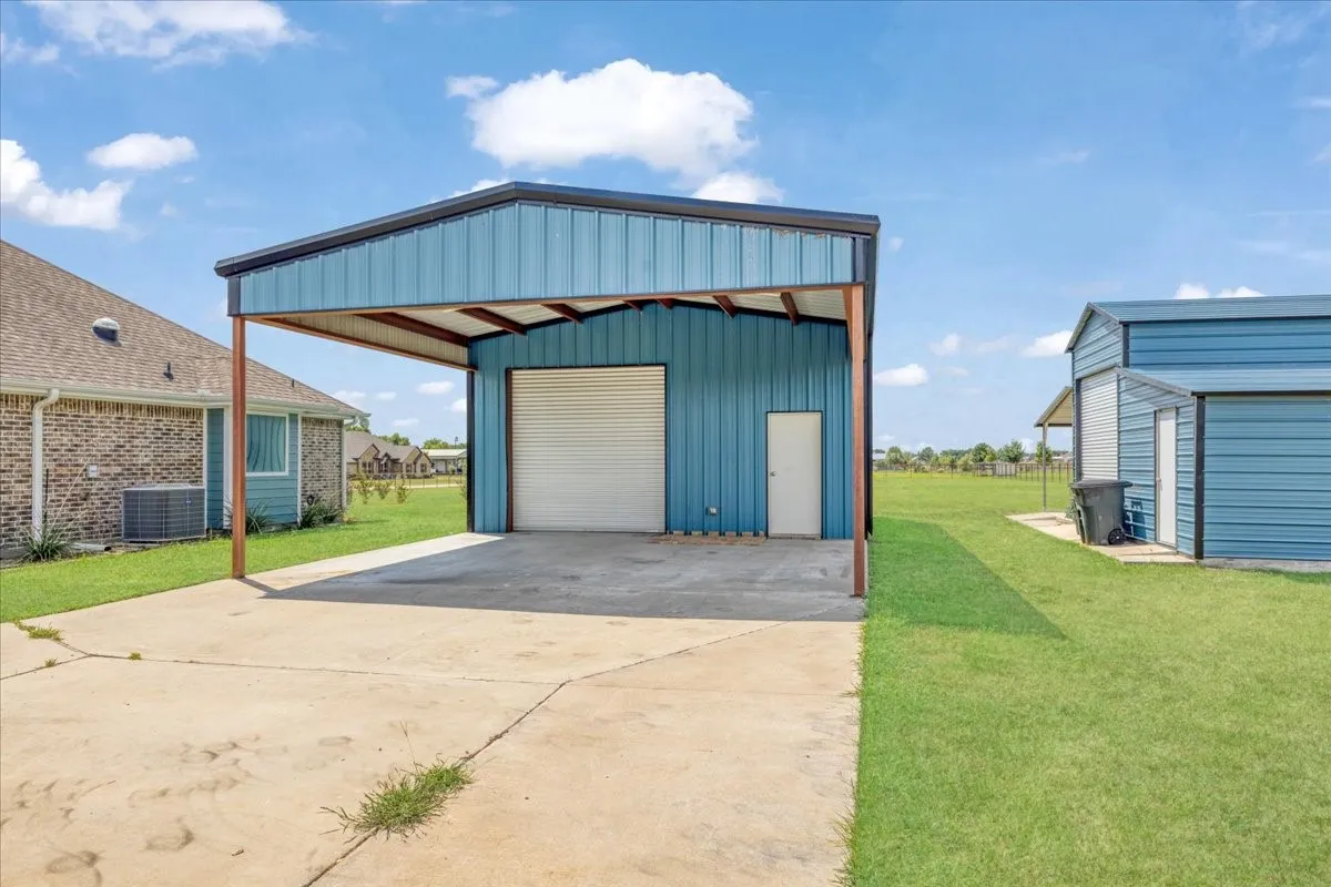 Interior of 24X24 workshop with 20X24 covered carport
