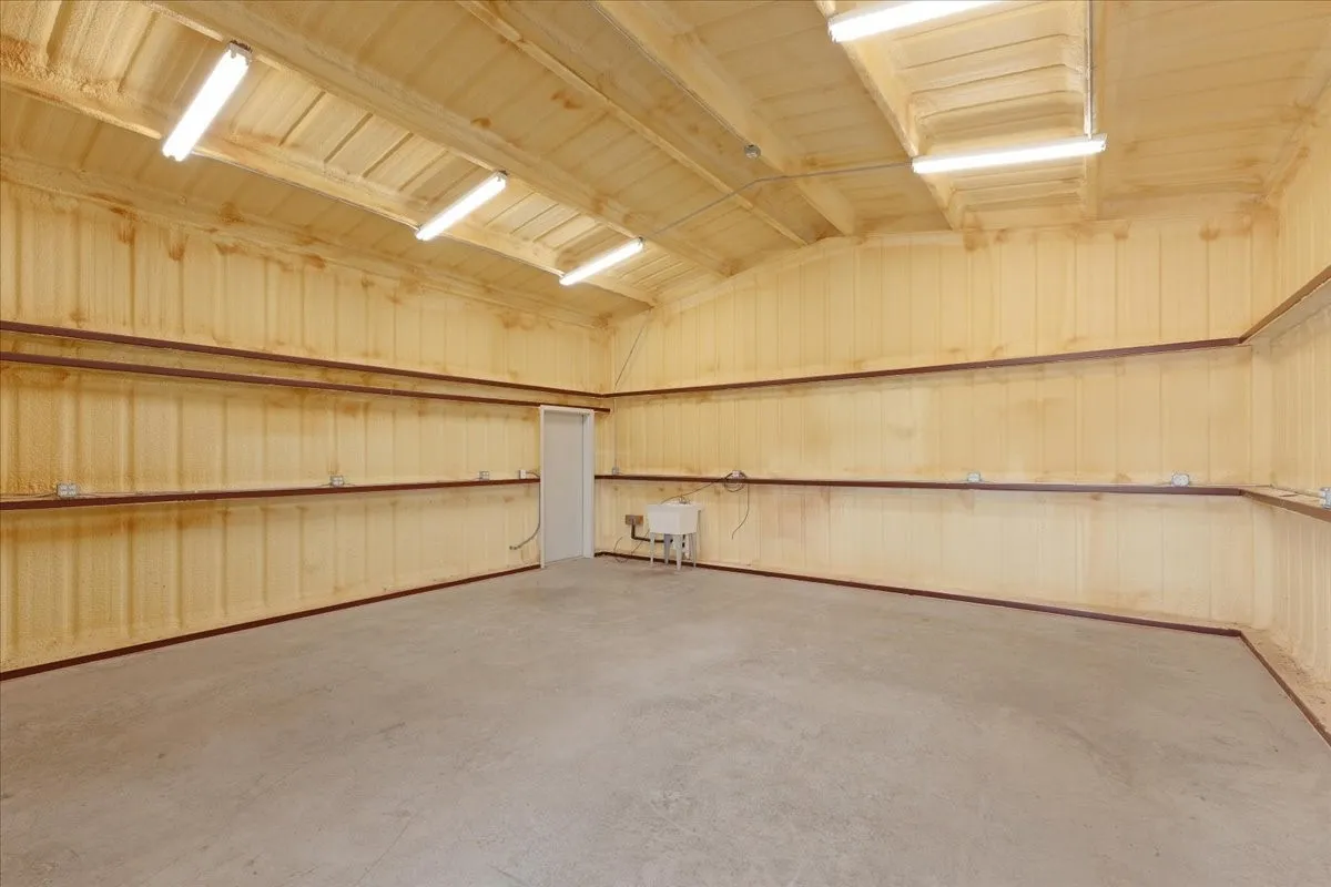 Interior of 24X24 workshop, electric, 2 exterior doors, (1) 10' roll up door