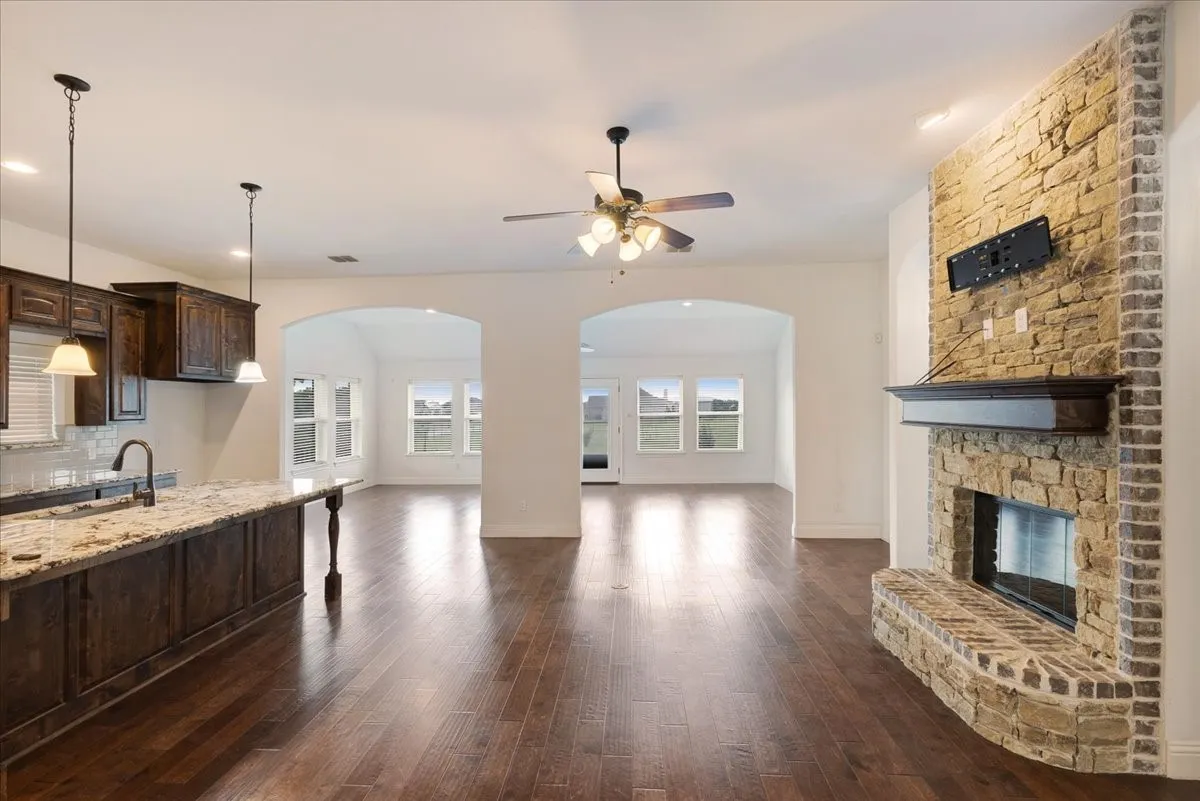 View of kitchen open to living area, peering into breakfast and 2nd living room