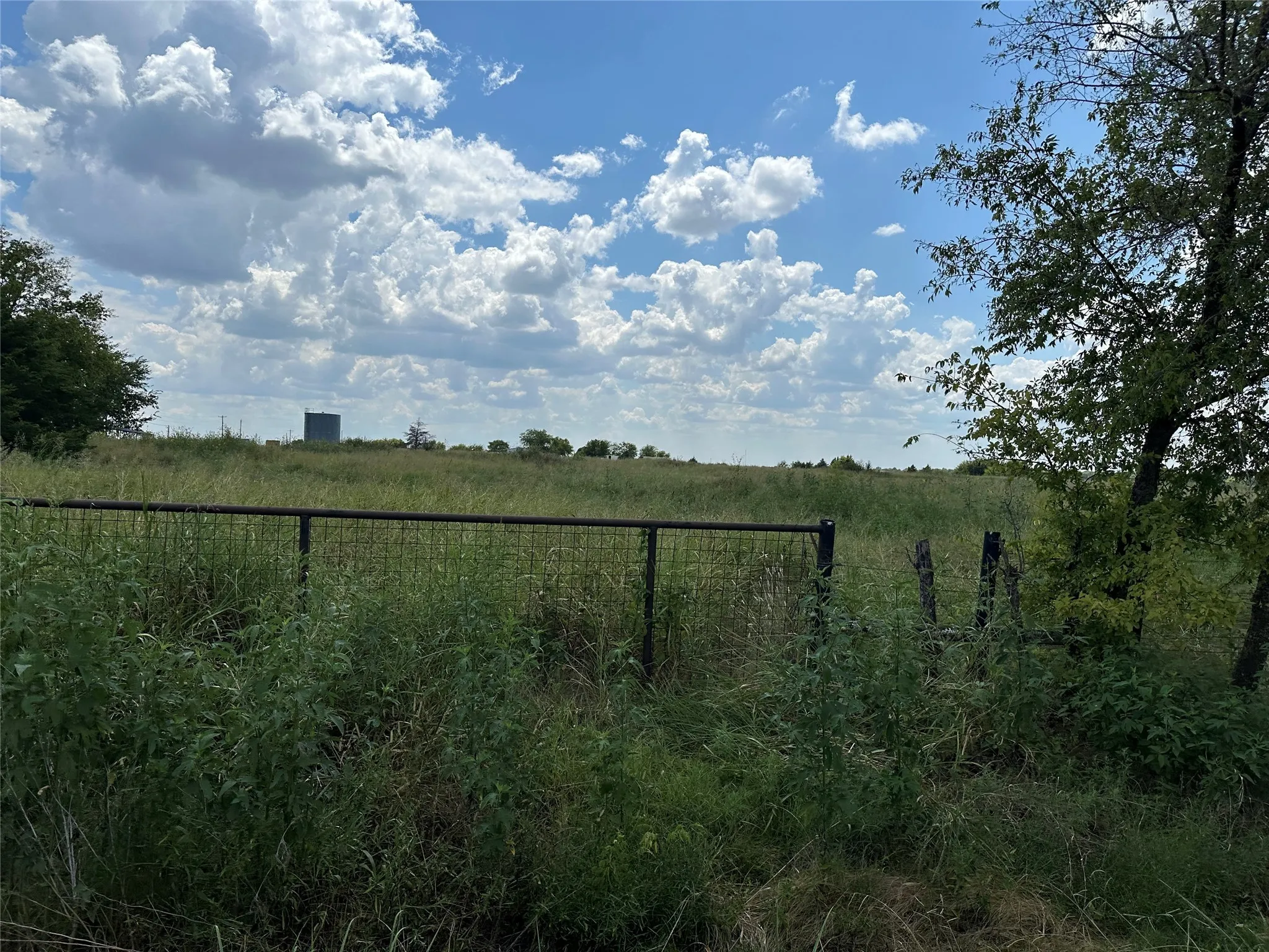 View of yard with a rural view