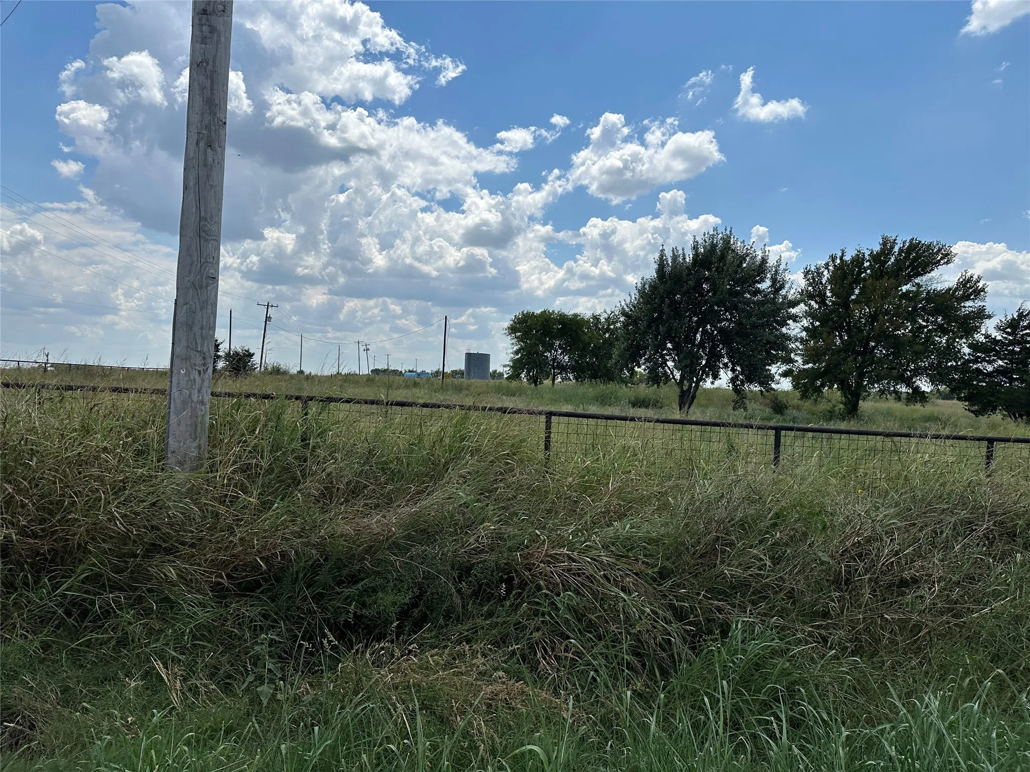View of yard with a rural view