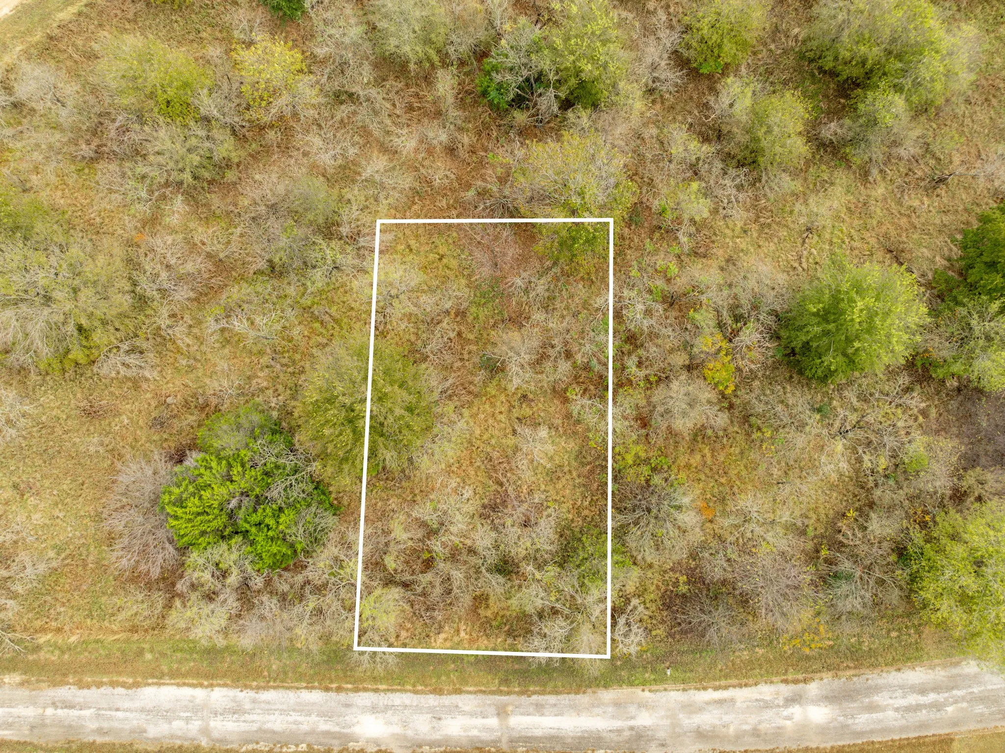 Aerial view of property and surrounding area featuring property boundaries highlighted