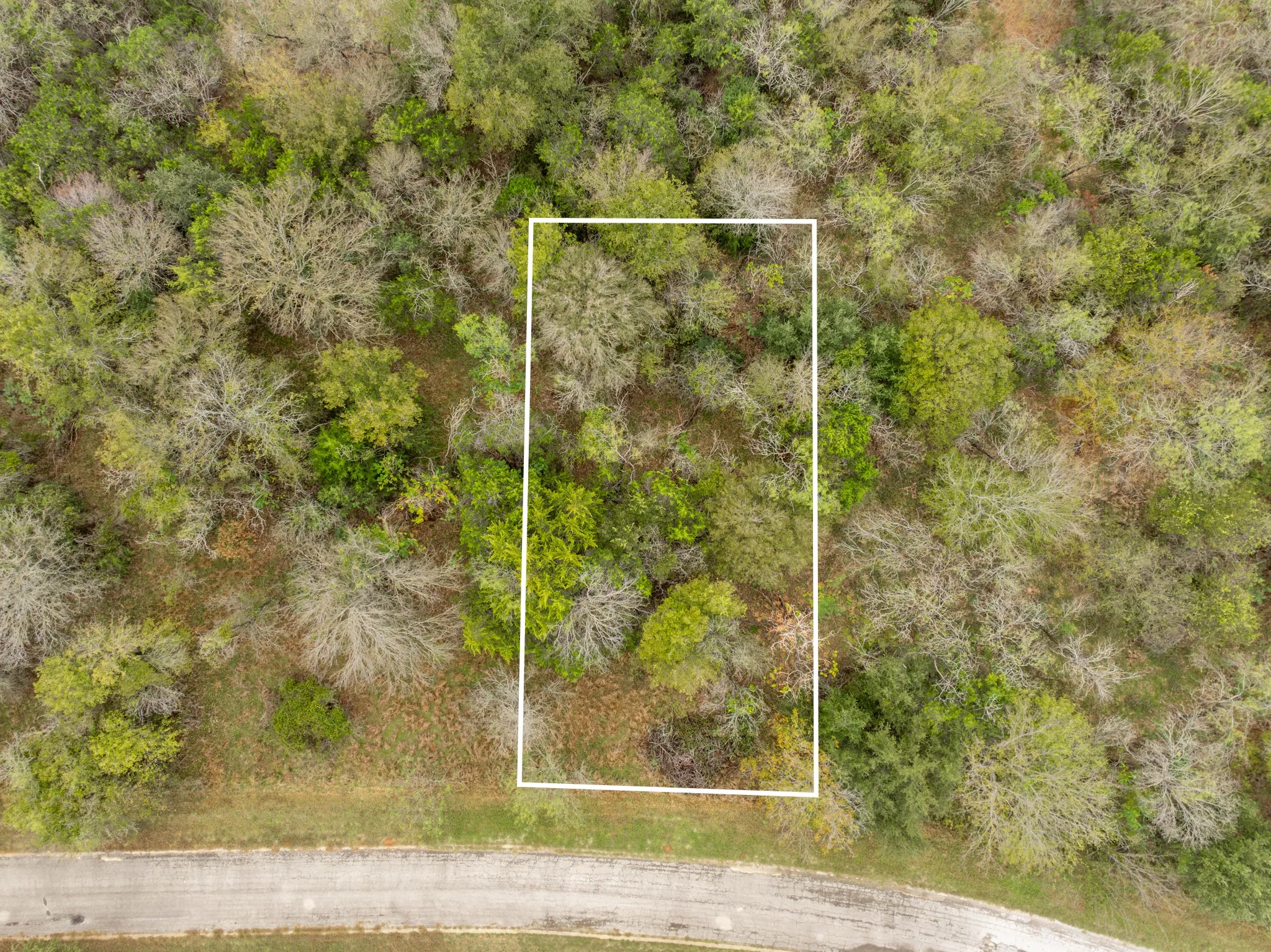 Aerial overview of property's location with property parcel outlined