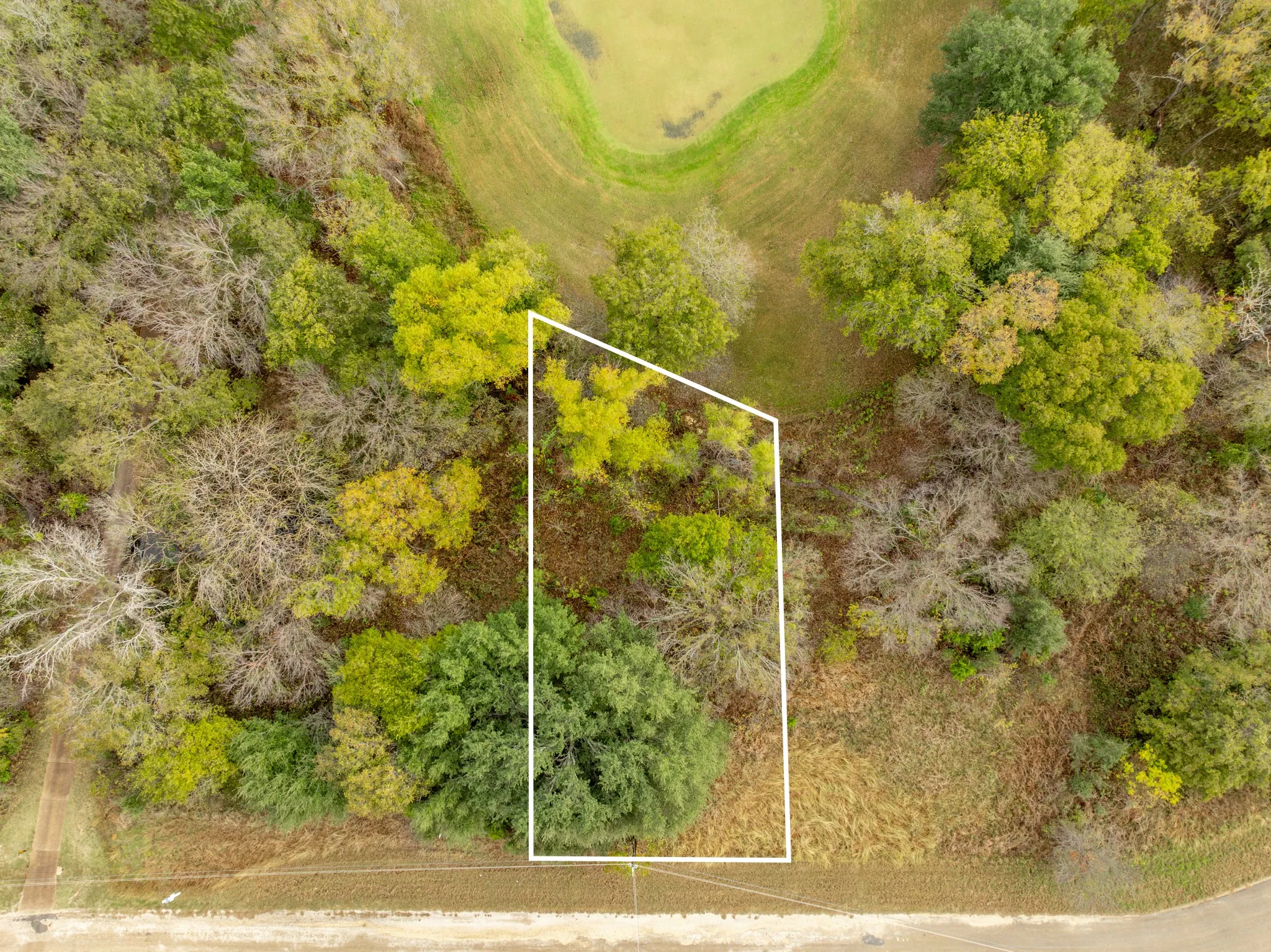 Aerial overview of property's location featuring property parcel outlined