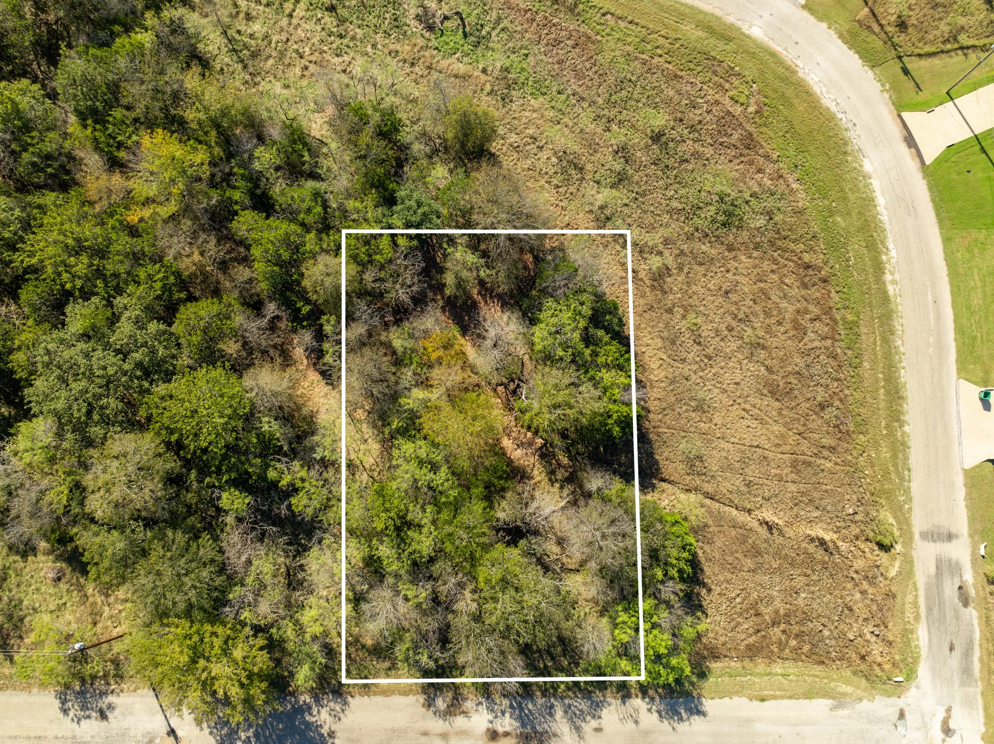 Aerial overview of property's location featuring property parcel outlined