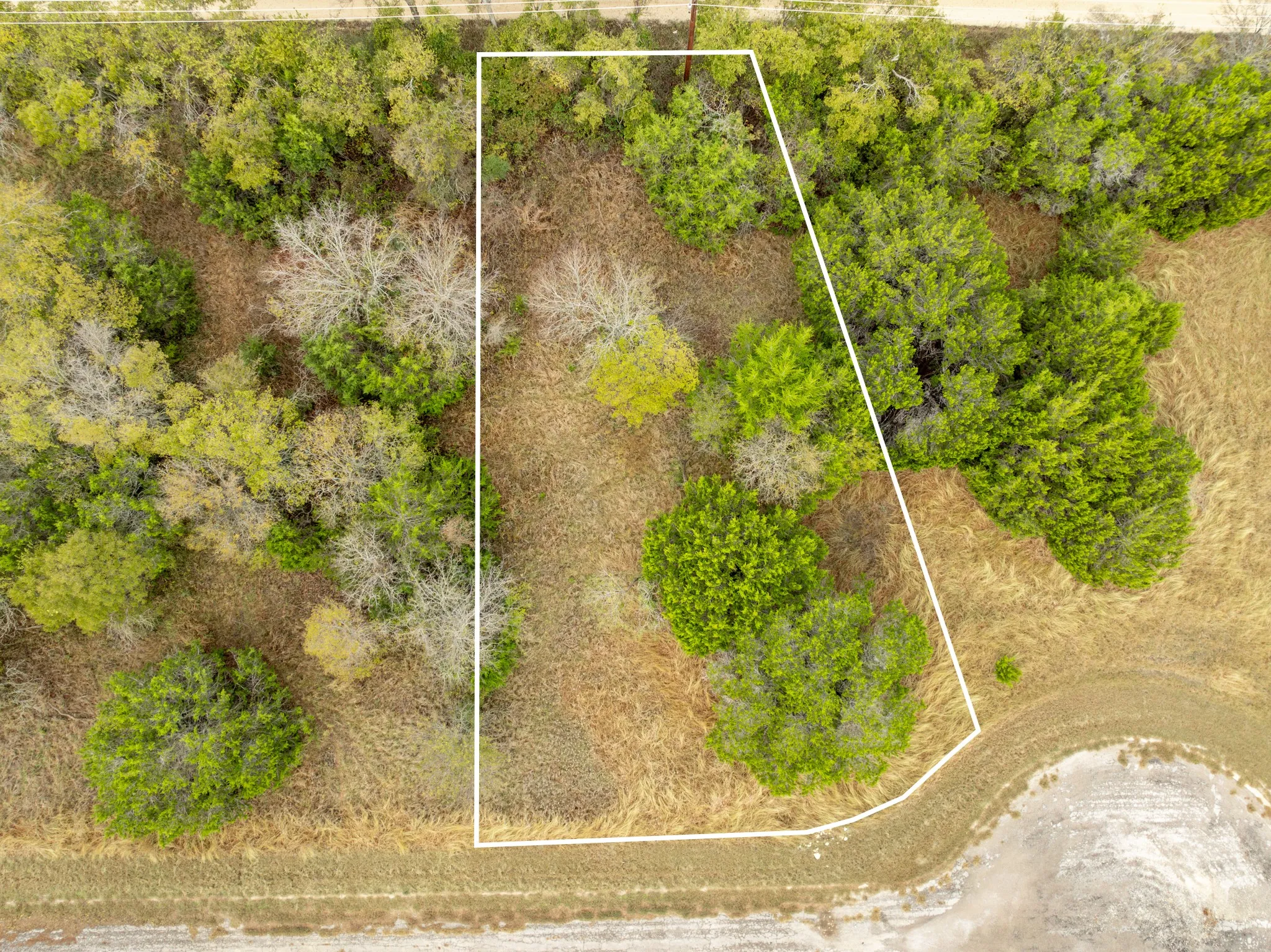 Aerial view of property and surrounding area featuring property boundaries highlighted