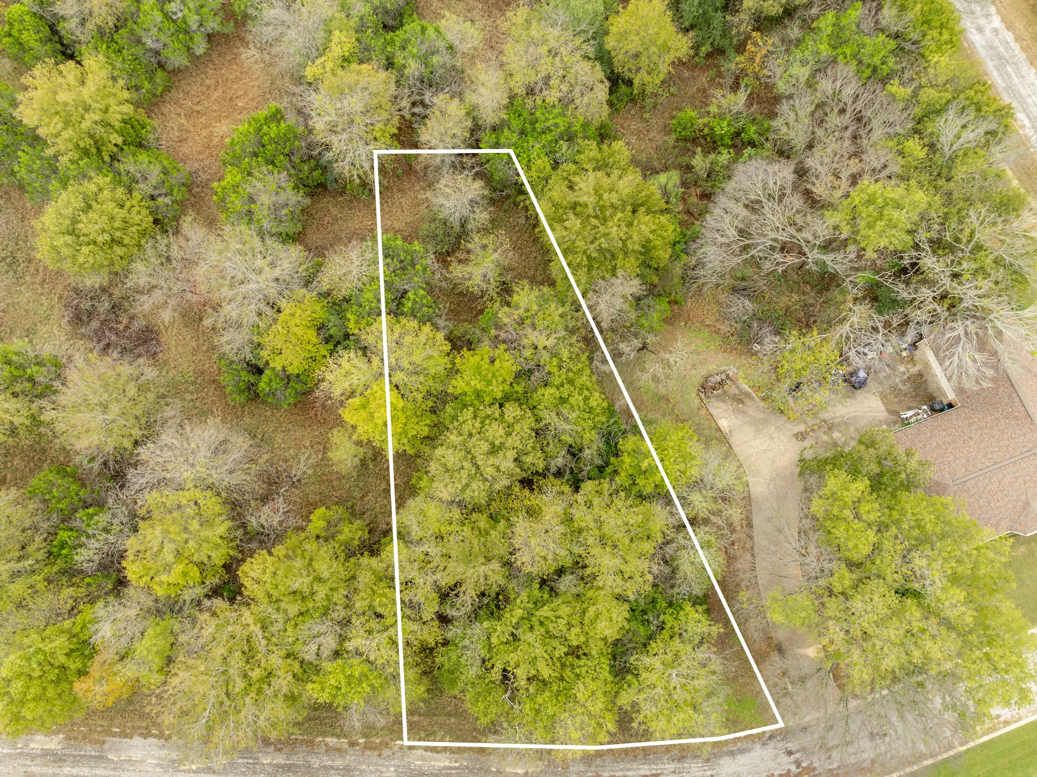 Aerial overview of property's location with property parcel outlined