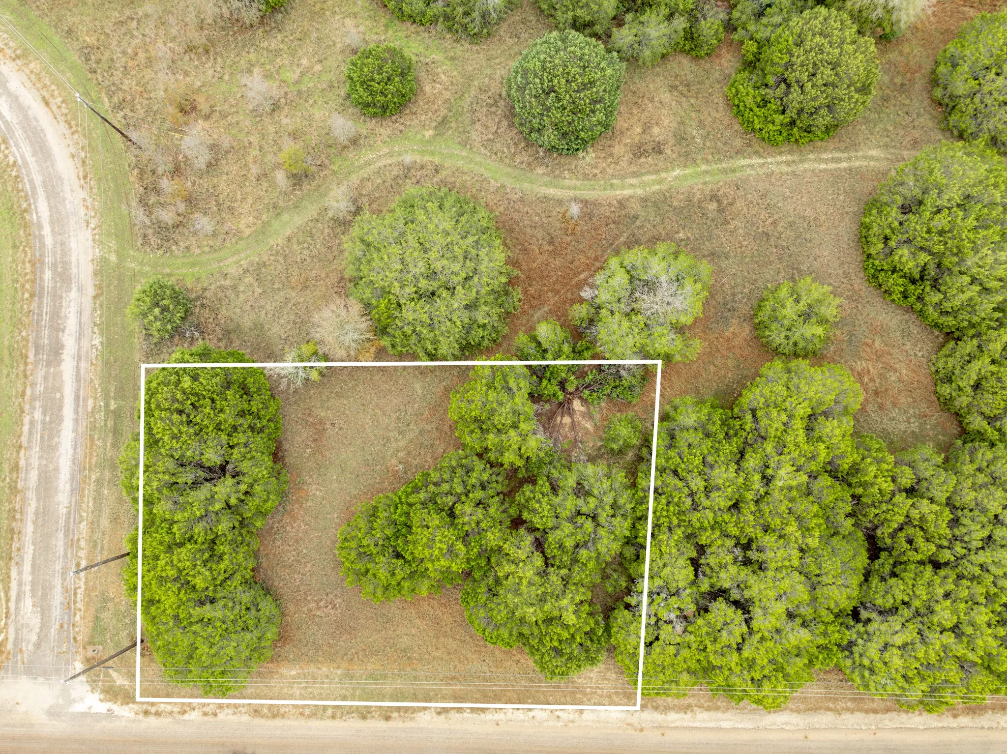 Aerial overview of property's location with property parcel outlined