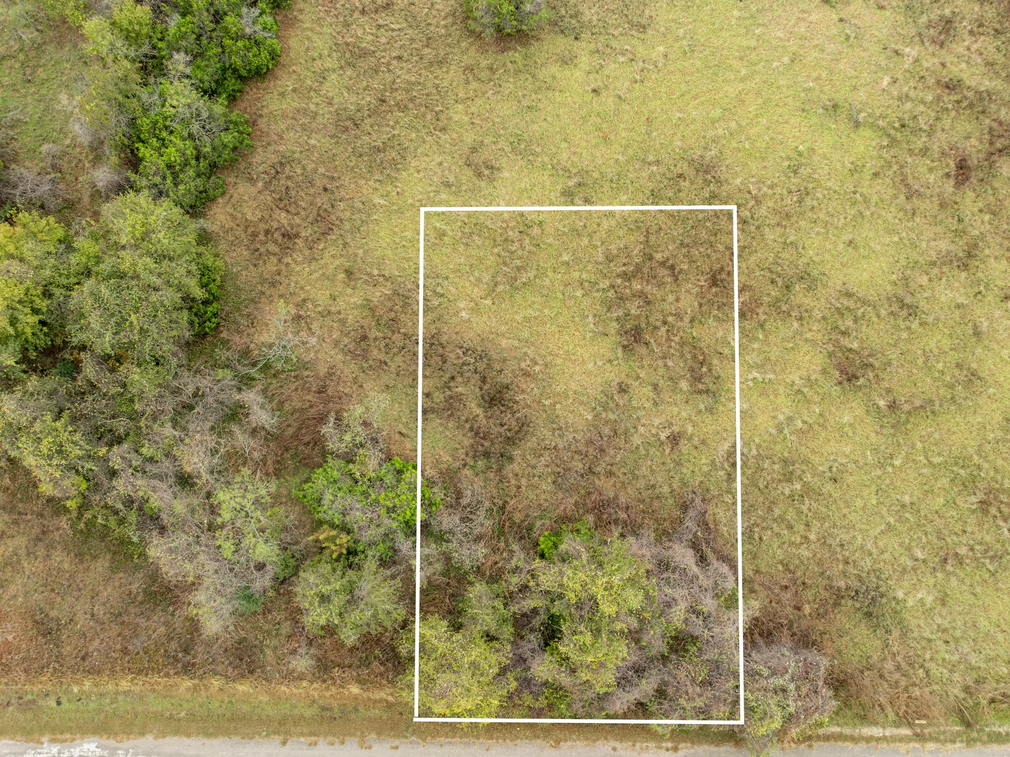 Aerial overview of property's location featuring property parcel outlined