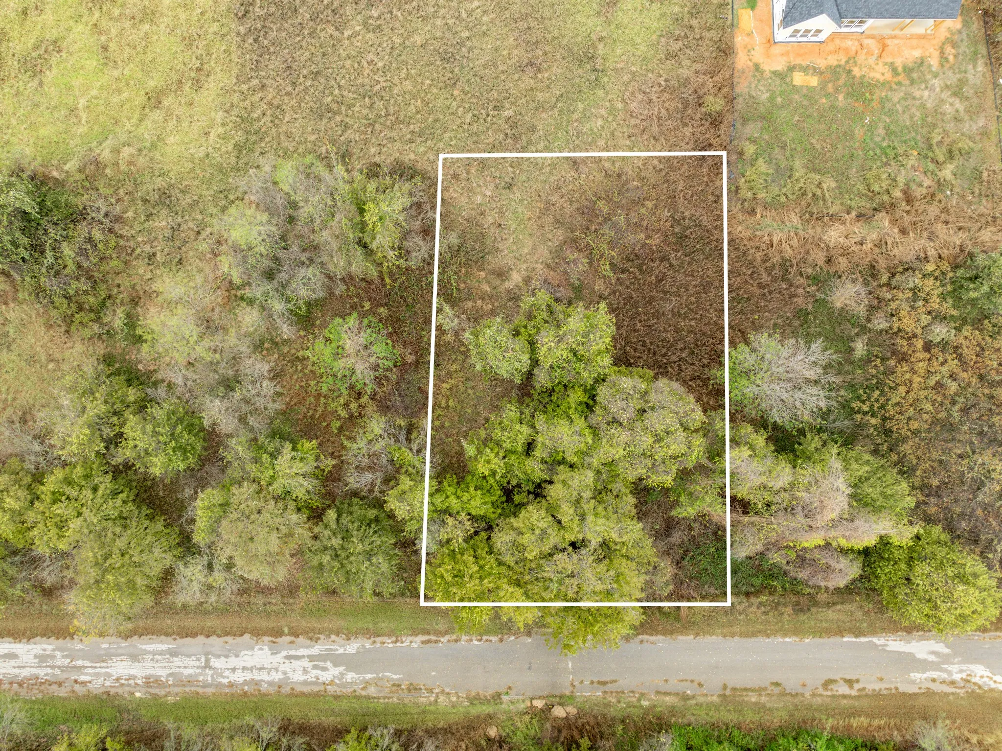 Aerial overview of property's location featuring property boundaries highlighted