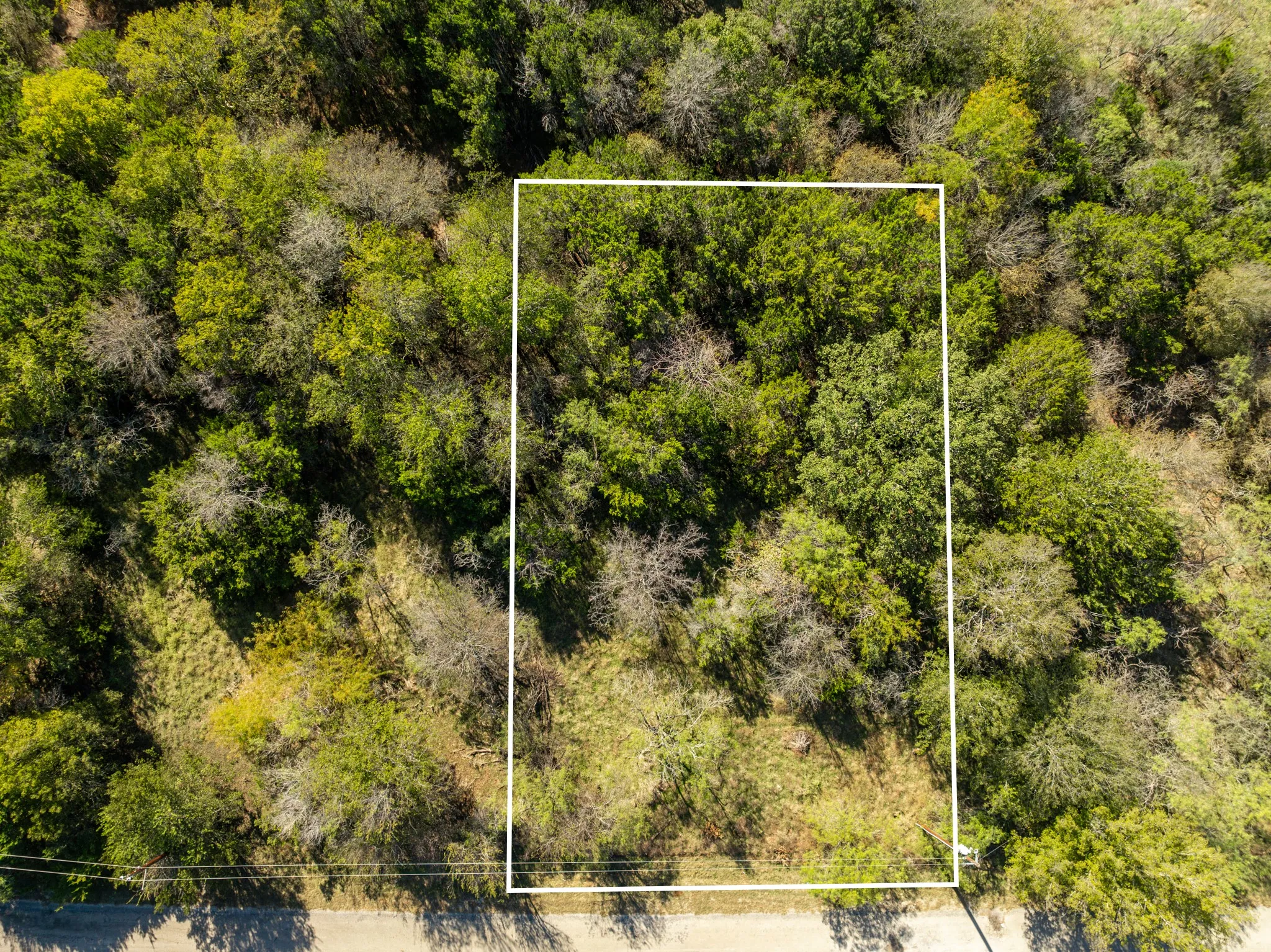 Aerial overview of property's location featuring property parcel outlined