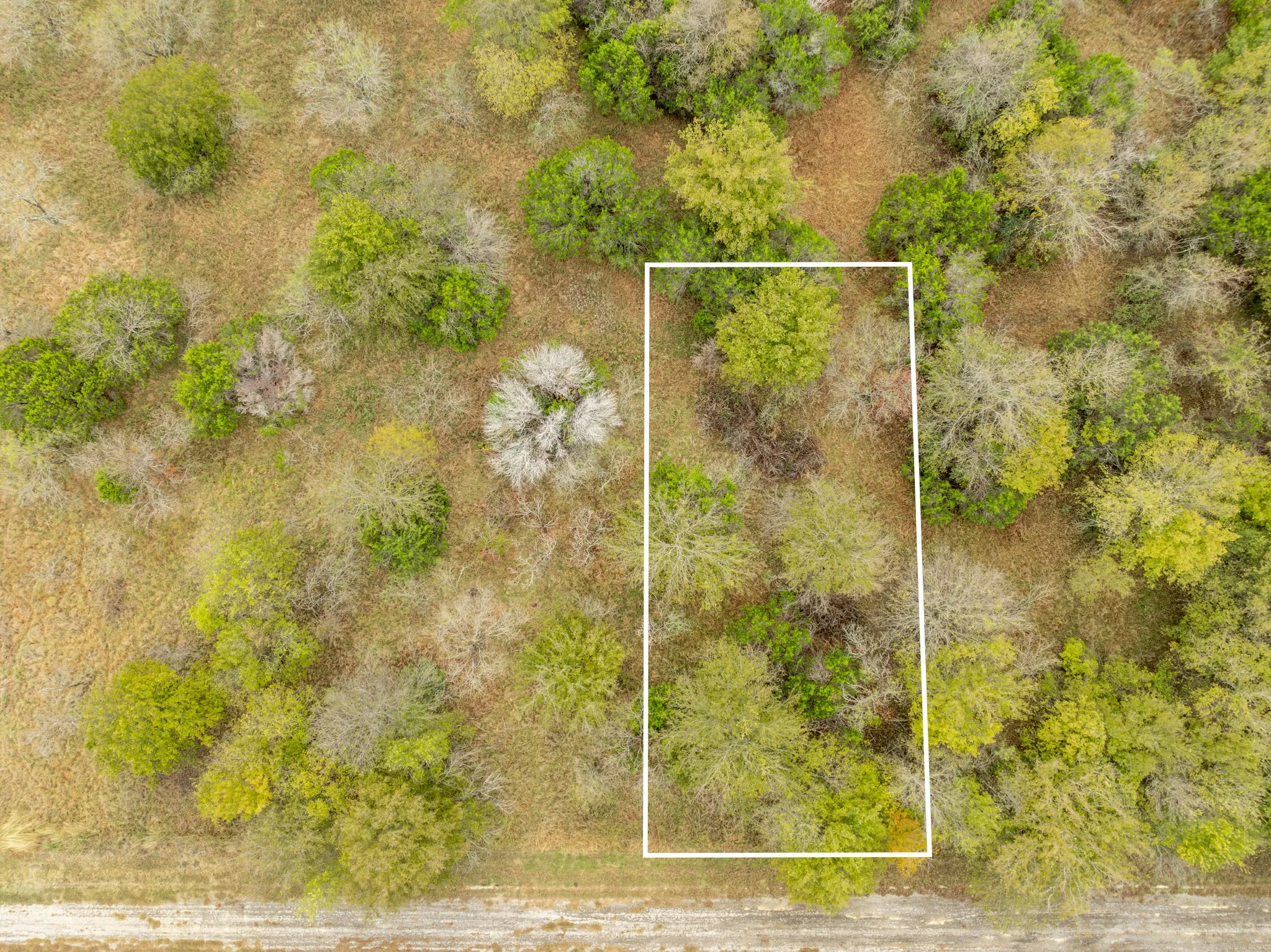 Aerial overview of property's location featuring property parcel outlined