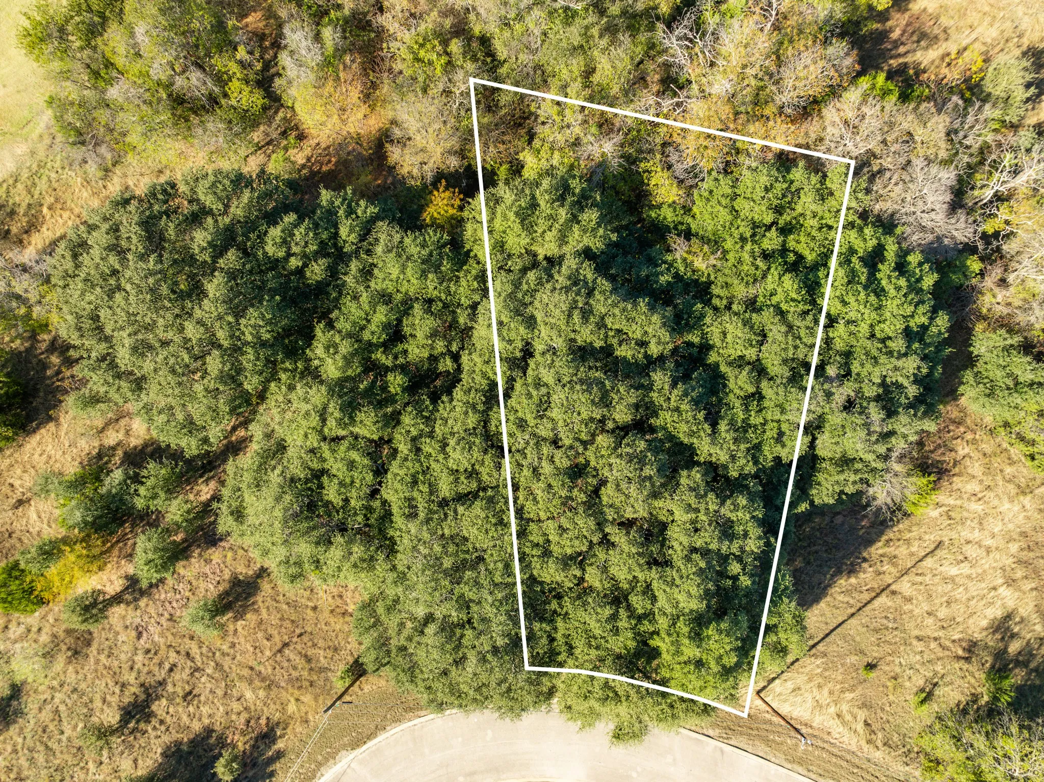 Aerial overview of property's location with property parcel outlined