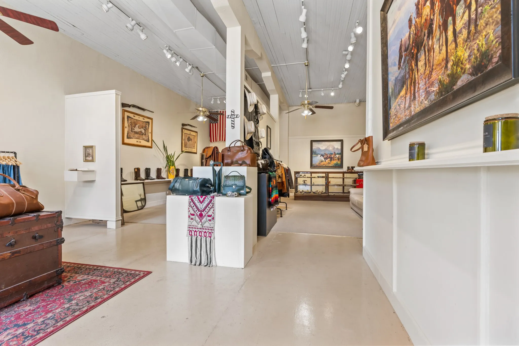 Reception featuring ceiling fan and a towering ceiling
