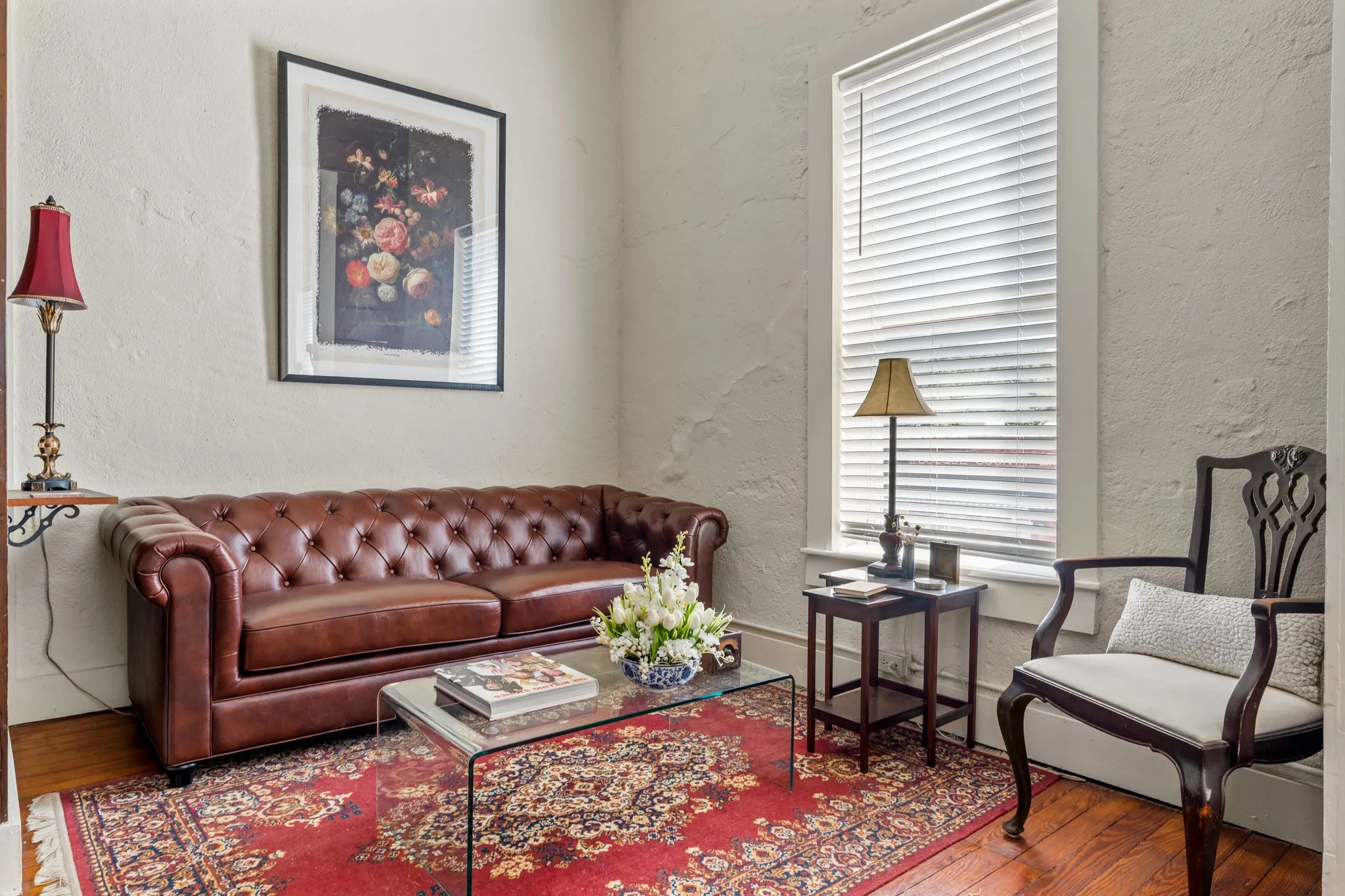 Living room featuring a textured wall and wood finished floors