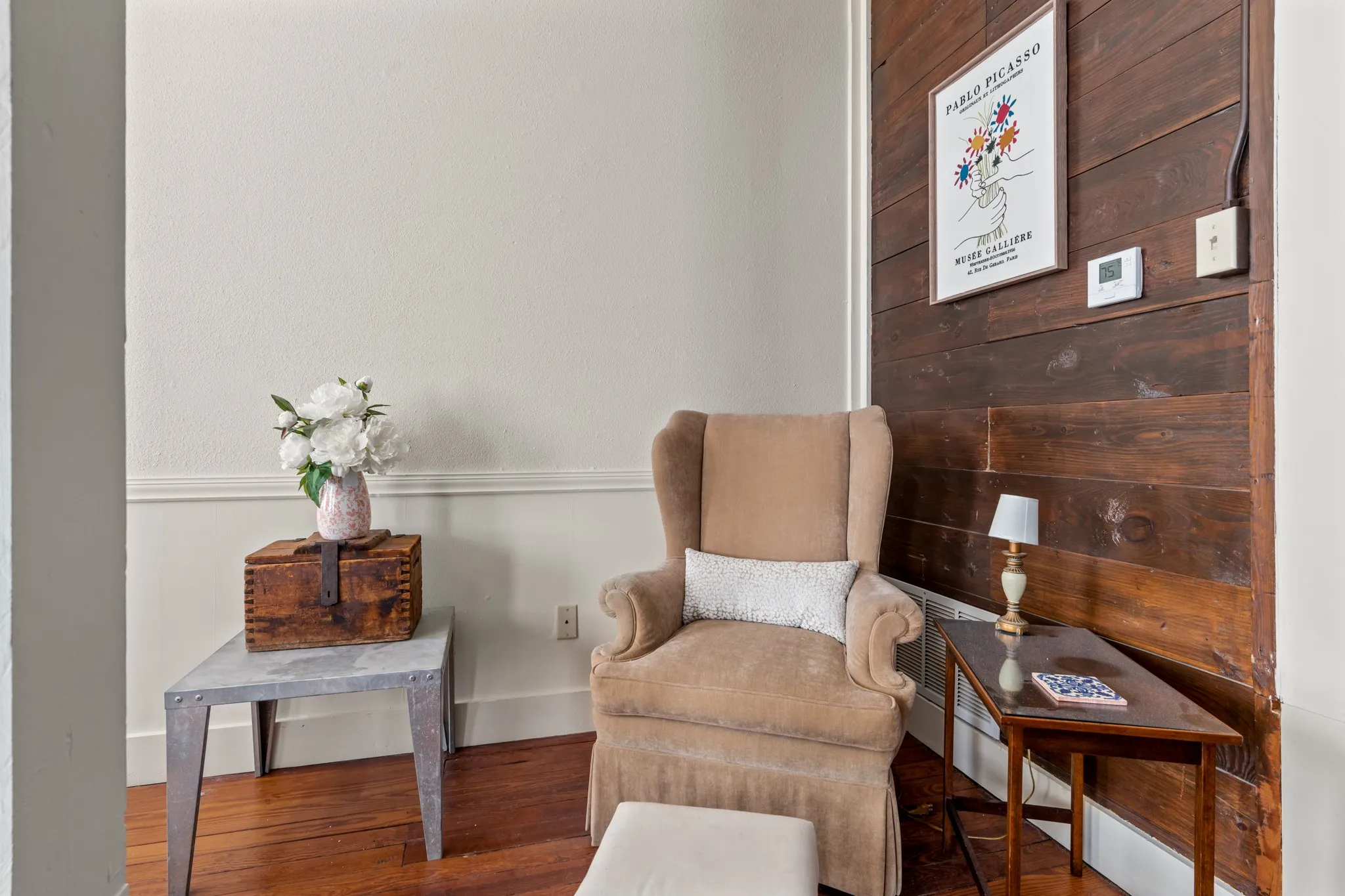 Living area featuring wood walls and wood finished floors