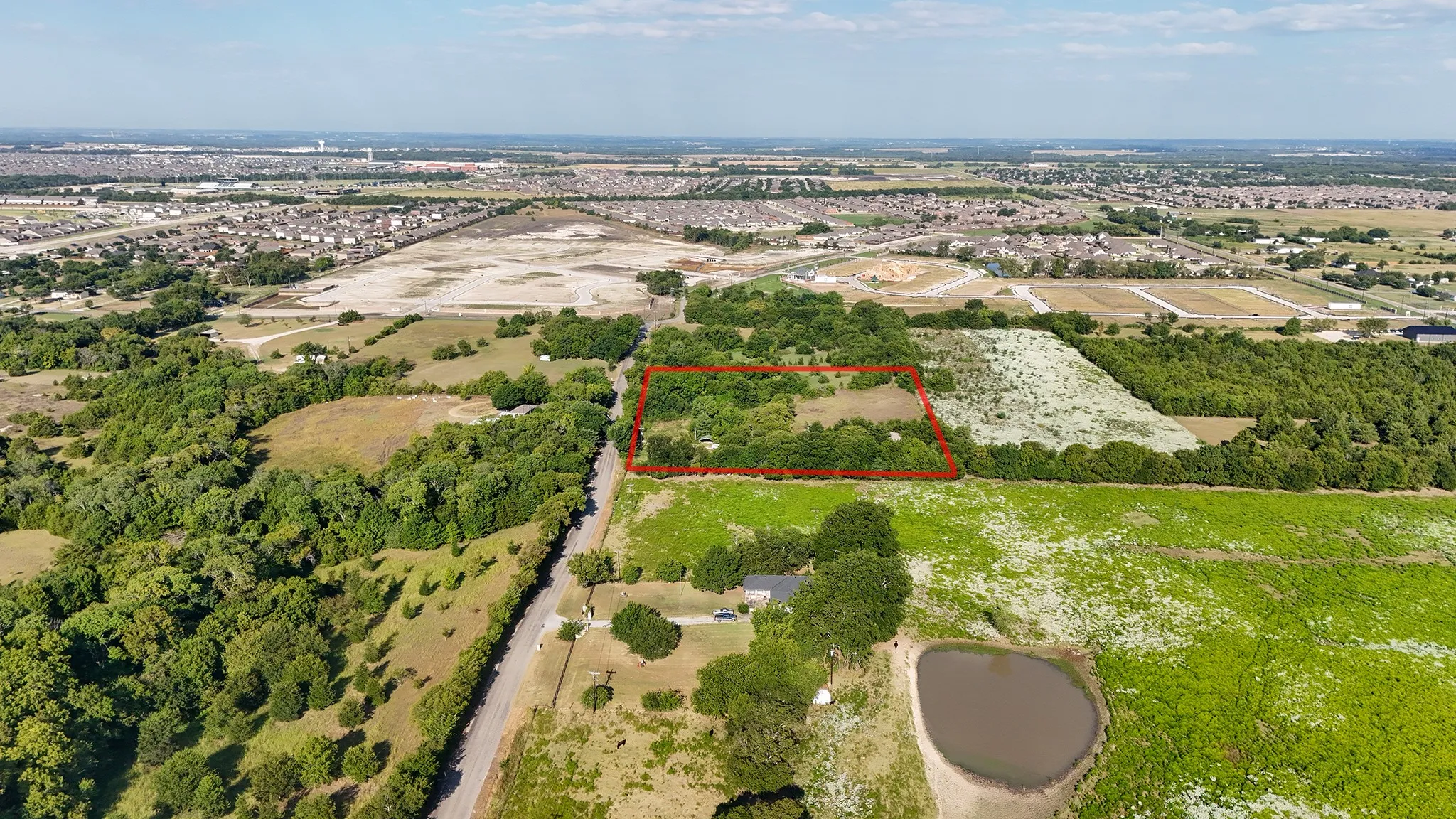 Aerial overview of property's location featuring property parcel outlined
