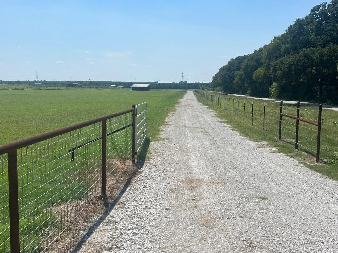 View of gravel road with a view of rural / pastoral area