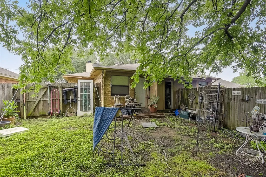 Right Unit Rear view of property featuring a gate and a chimney