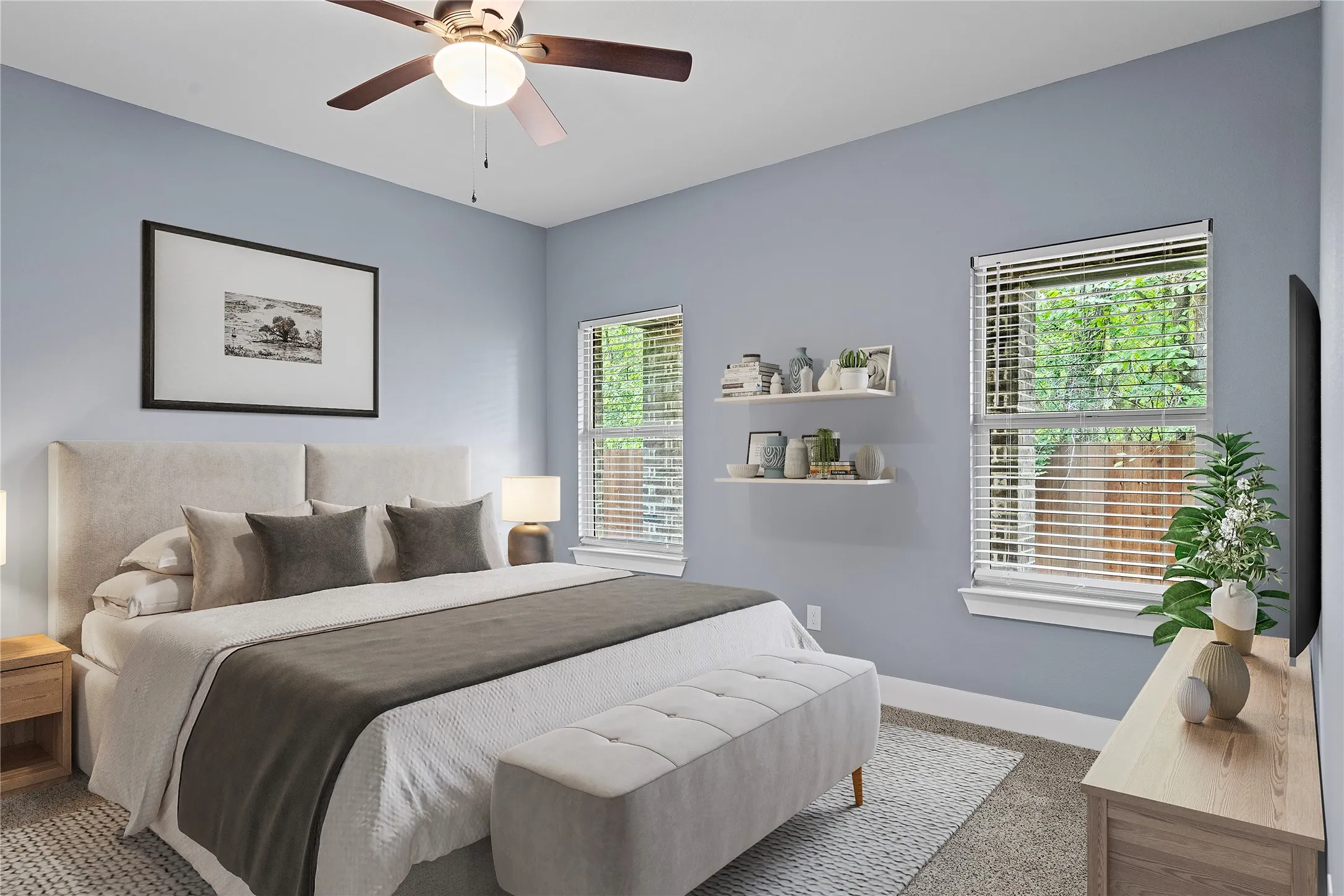 Carpeted bedroom with baseboards and a ceiling fan