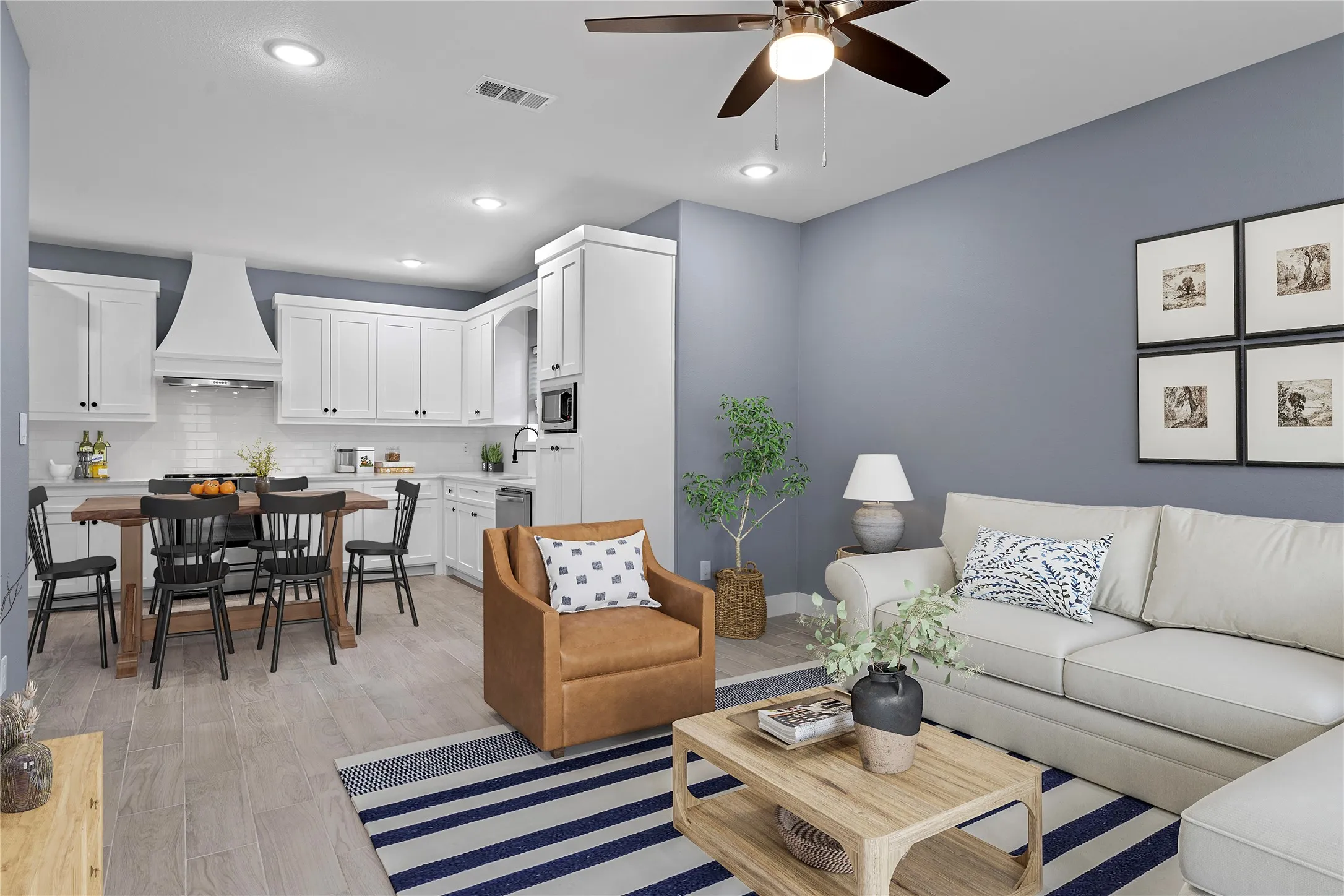 Living area featuring light wood-type flooring, recessed lighting, and a ceiling fan