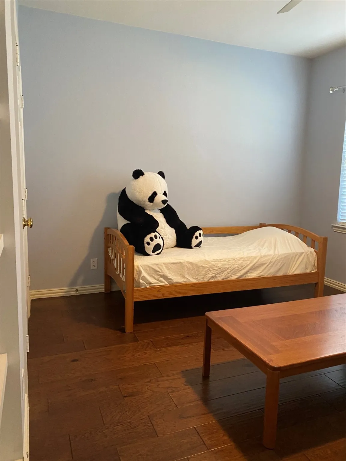 Bedroom featuring a ceiling fan and wood-type flooring