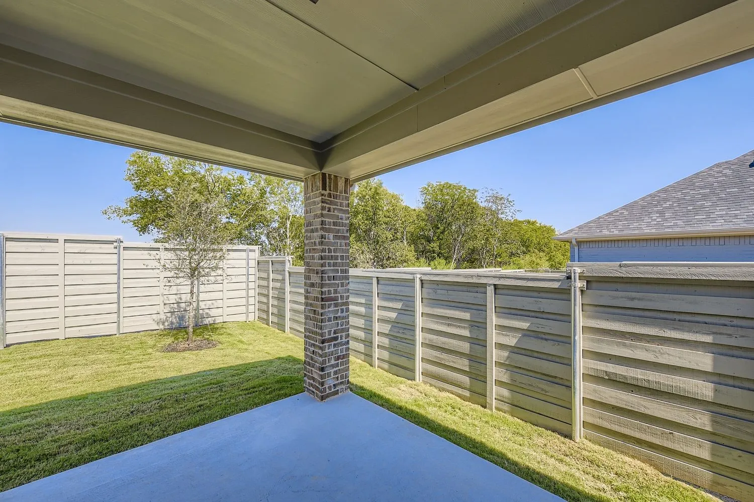 Fenced backyard featuring a patio area