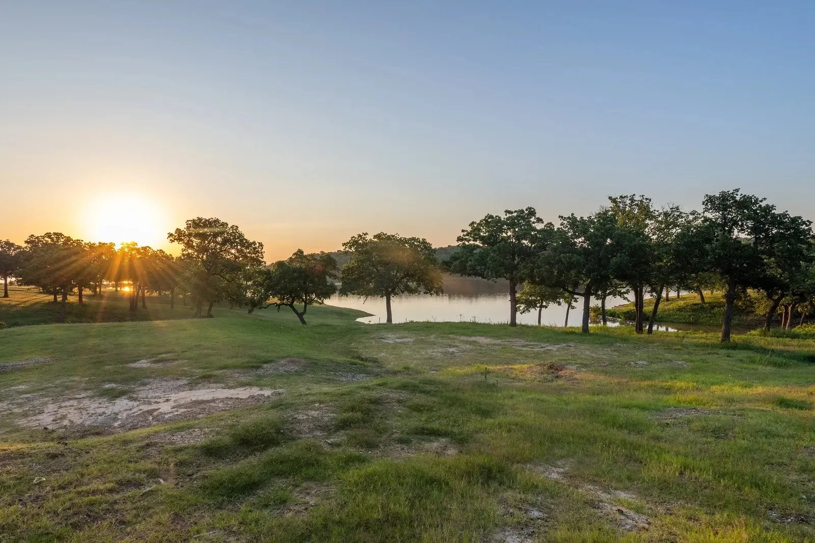 View of green lawn with a water view