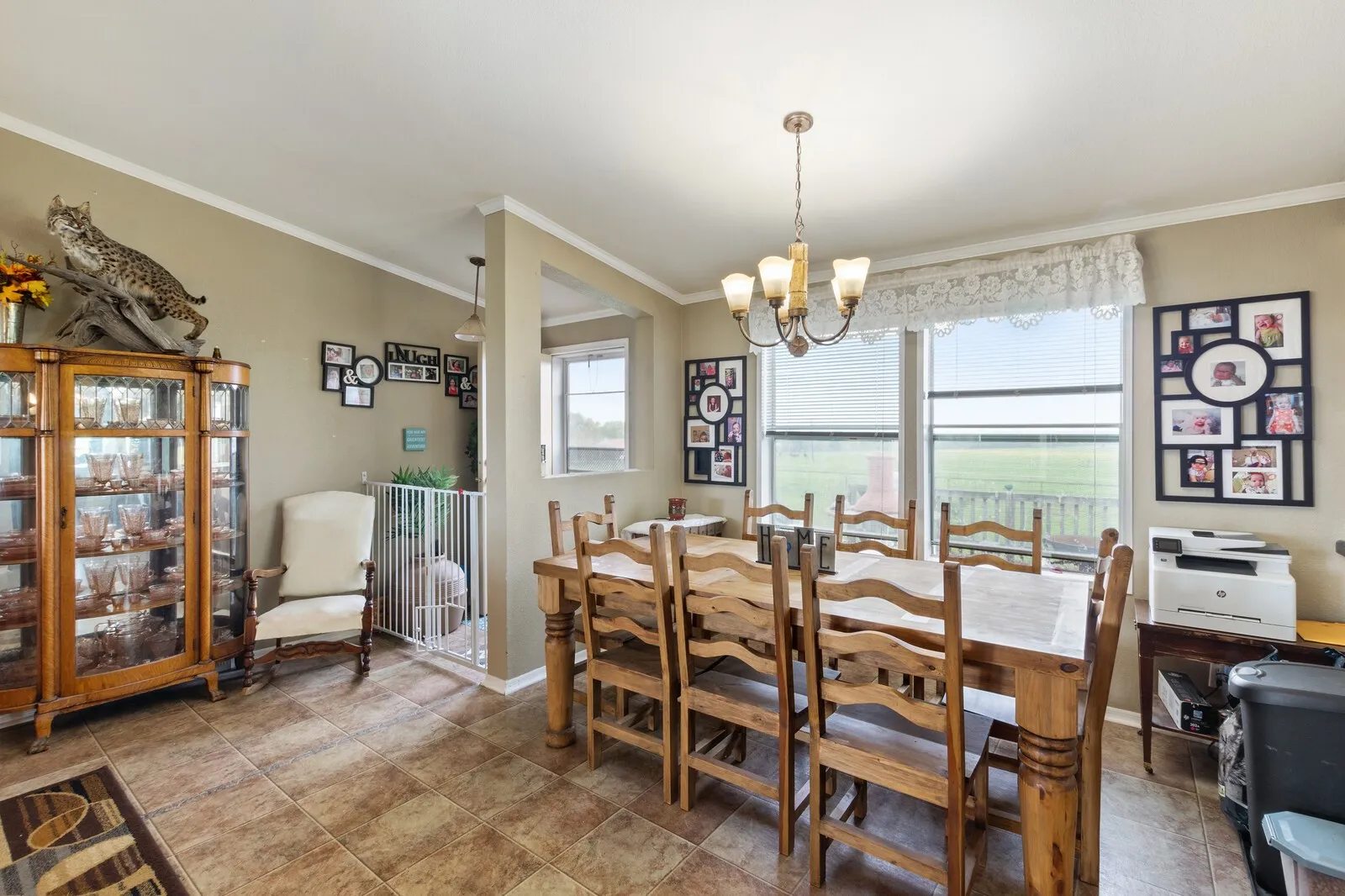 Dining room with crown molding and a chandelier