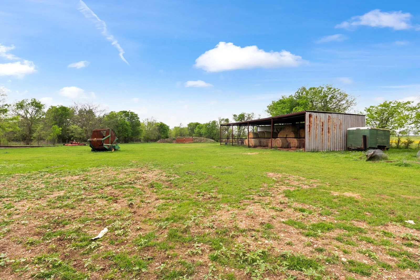 View of green lawn featuring an outdoor structure and an outbuilding