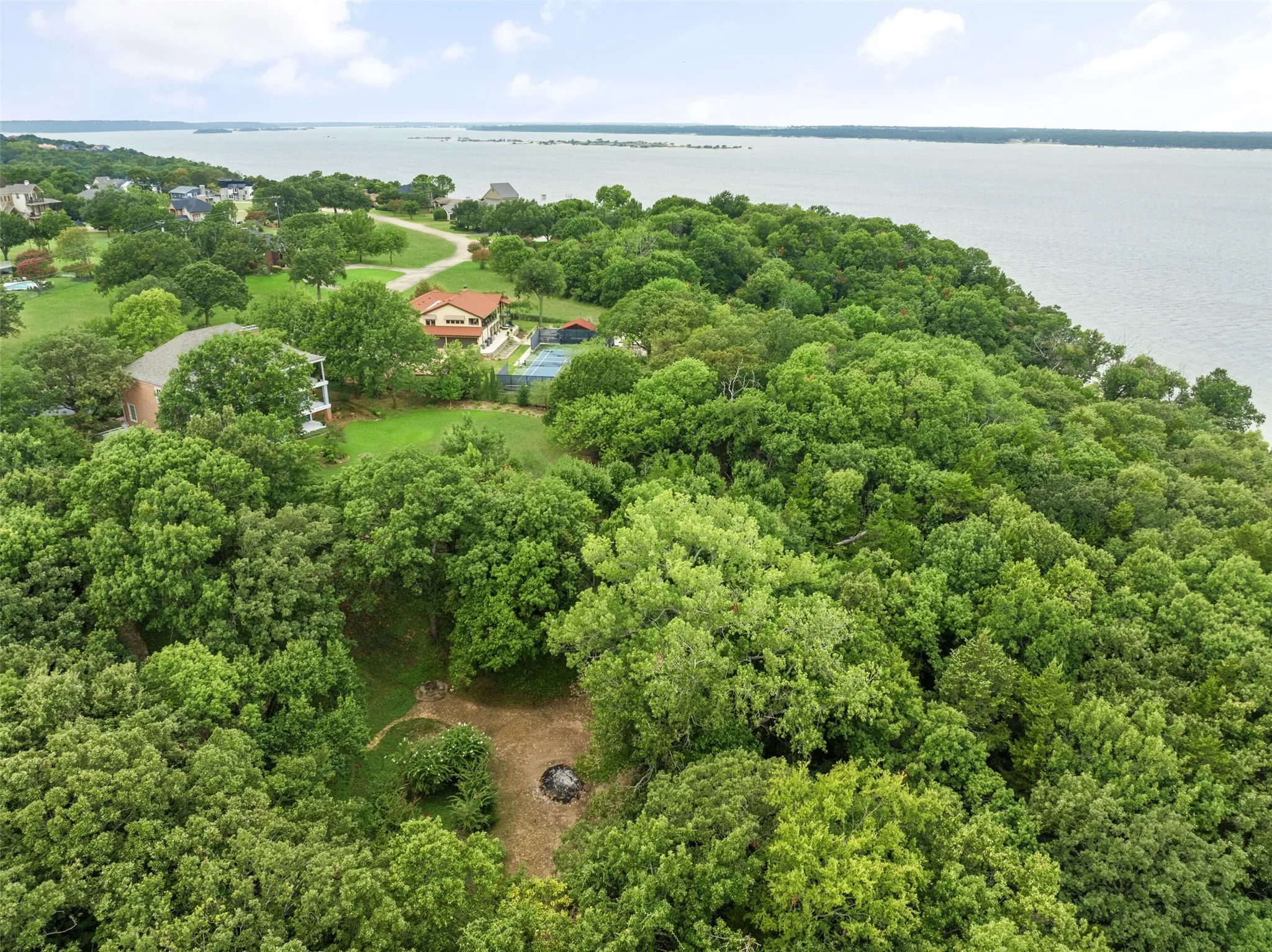 Aerial view of property and lake.