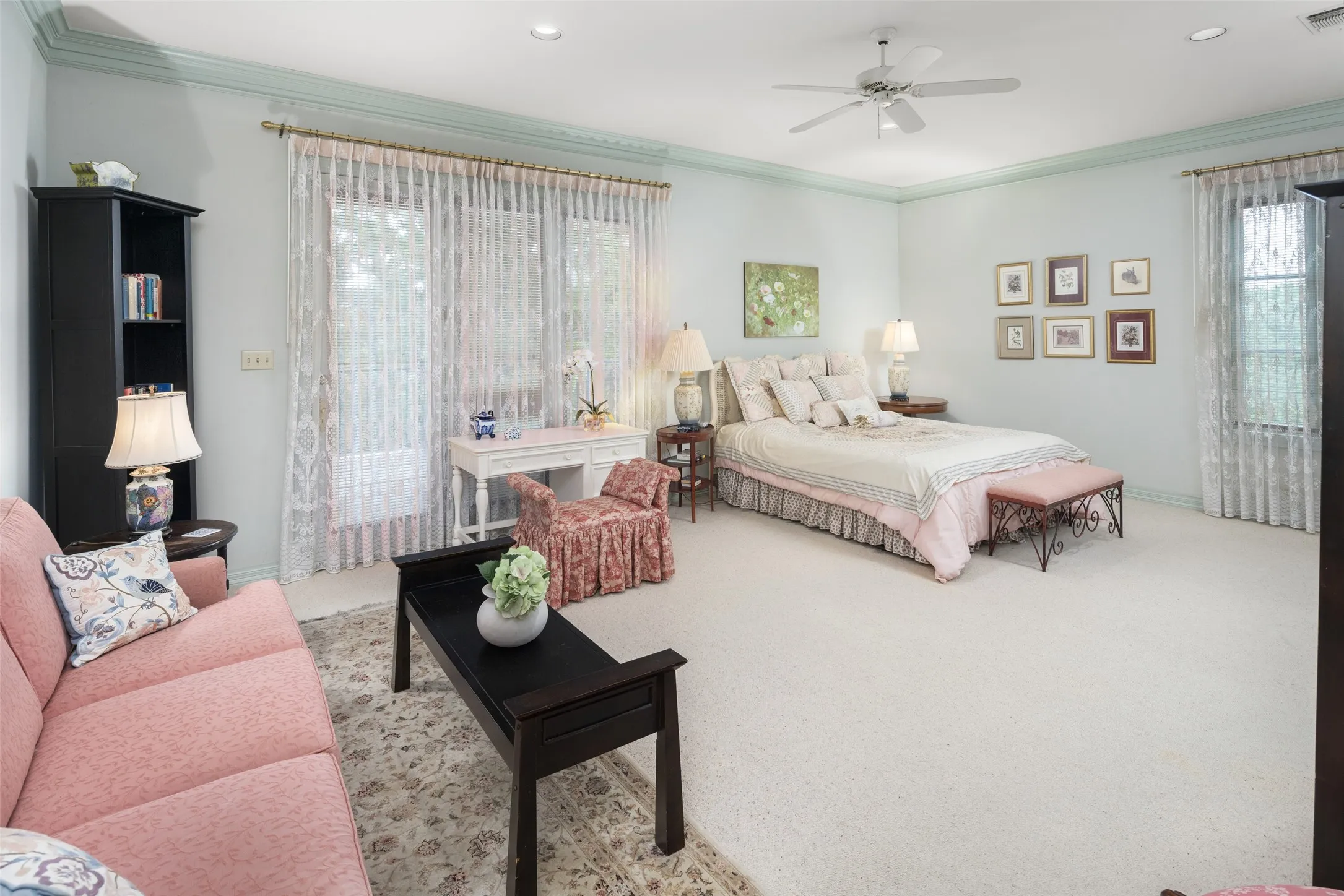 Oversized primary bedroom with a private balcony located on the third level.