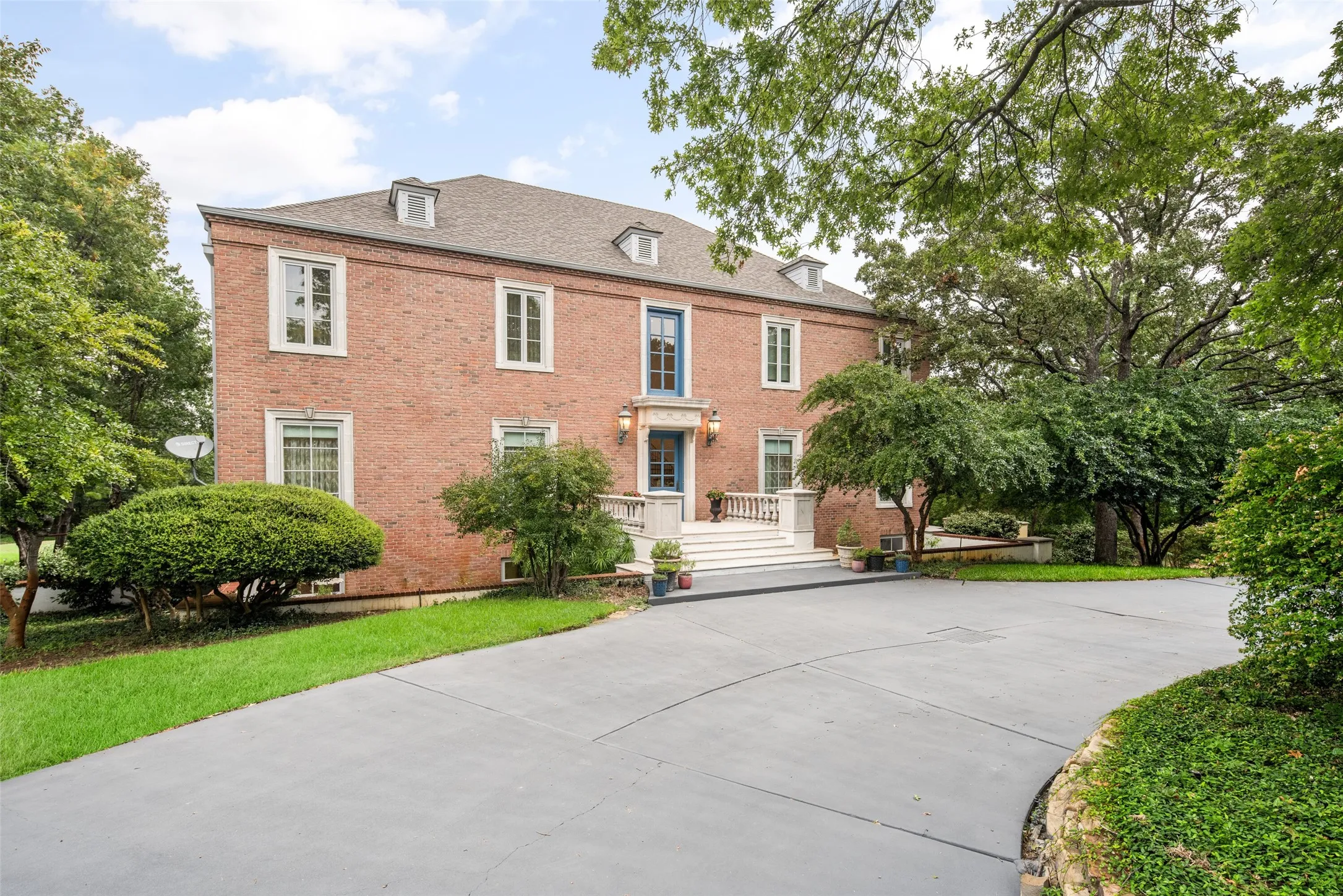 View of front of property featuring brick siding