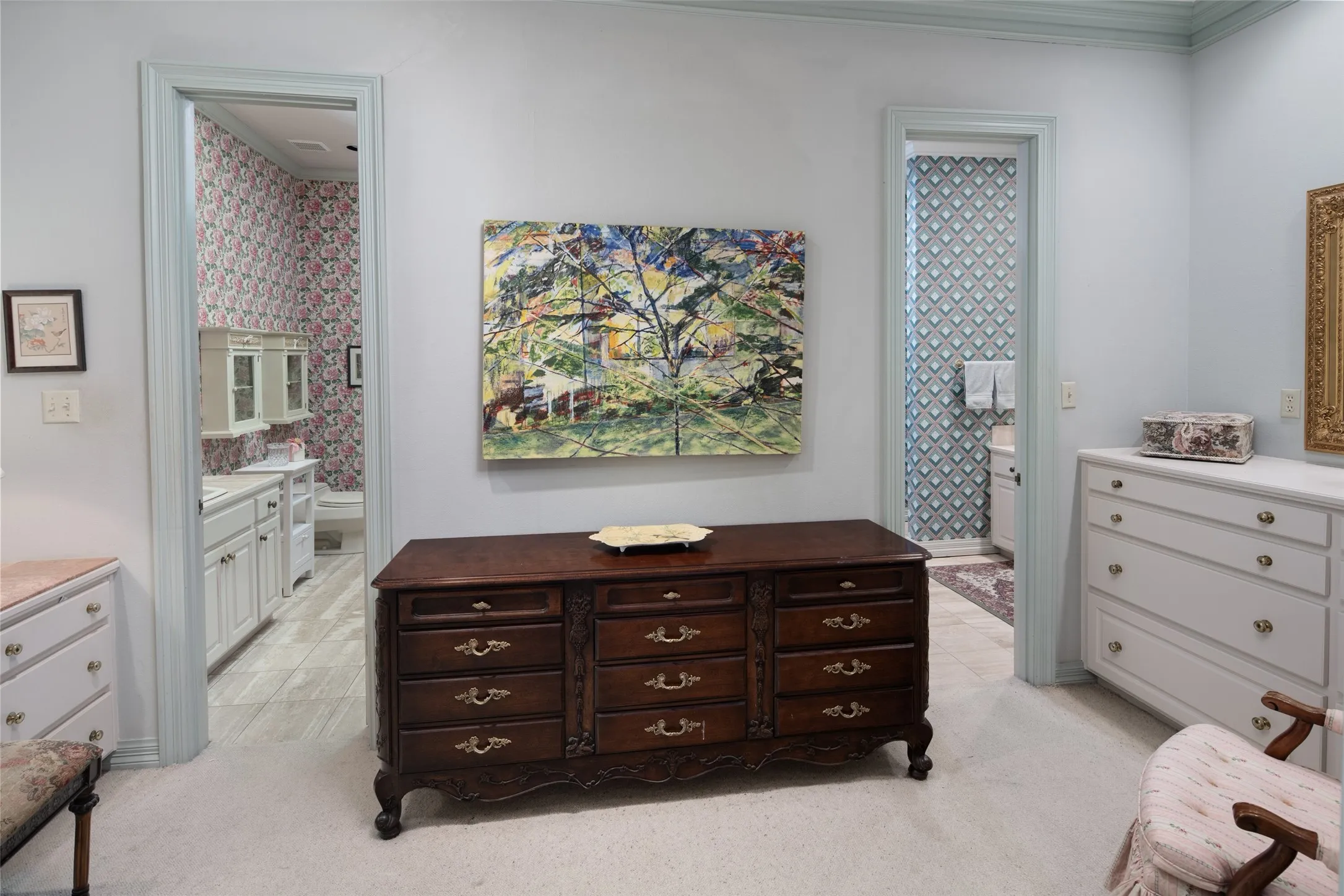His and her ensuite baths with built in storage.