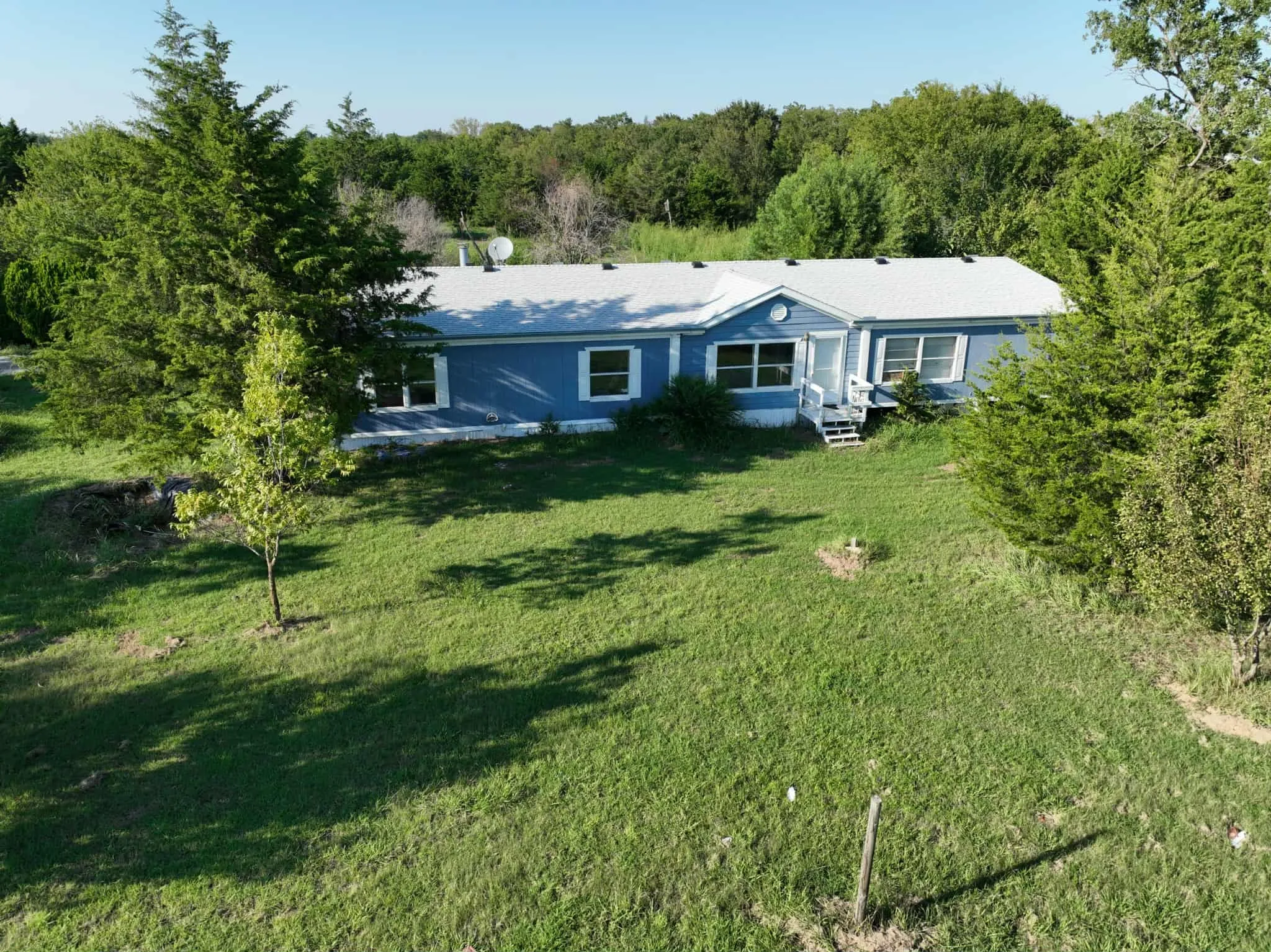 Ranch-style home with a front yard