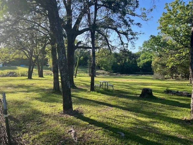 View of home's community featuring a yard