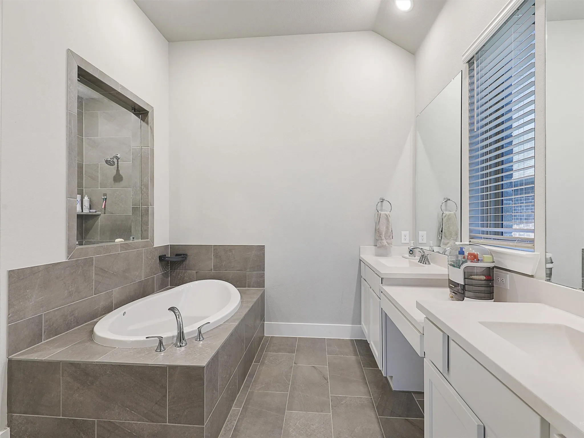 Unwind in your luxurious ensuite bathroom, complete with a soaking tub, separate walk-in shower, dual vanities, and a large walk-in closet with built-ins.