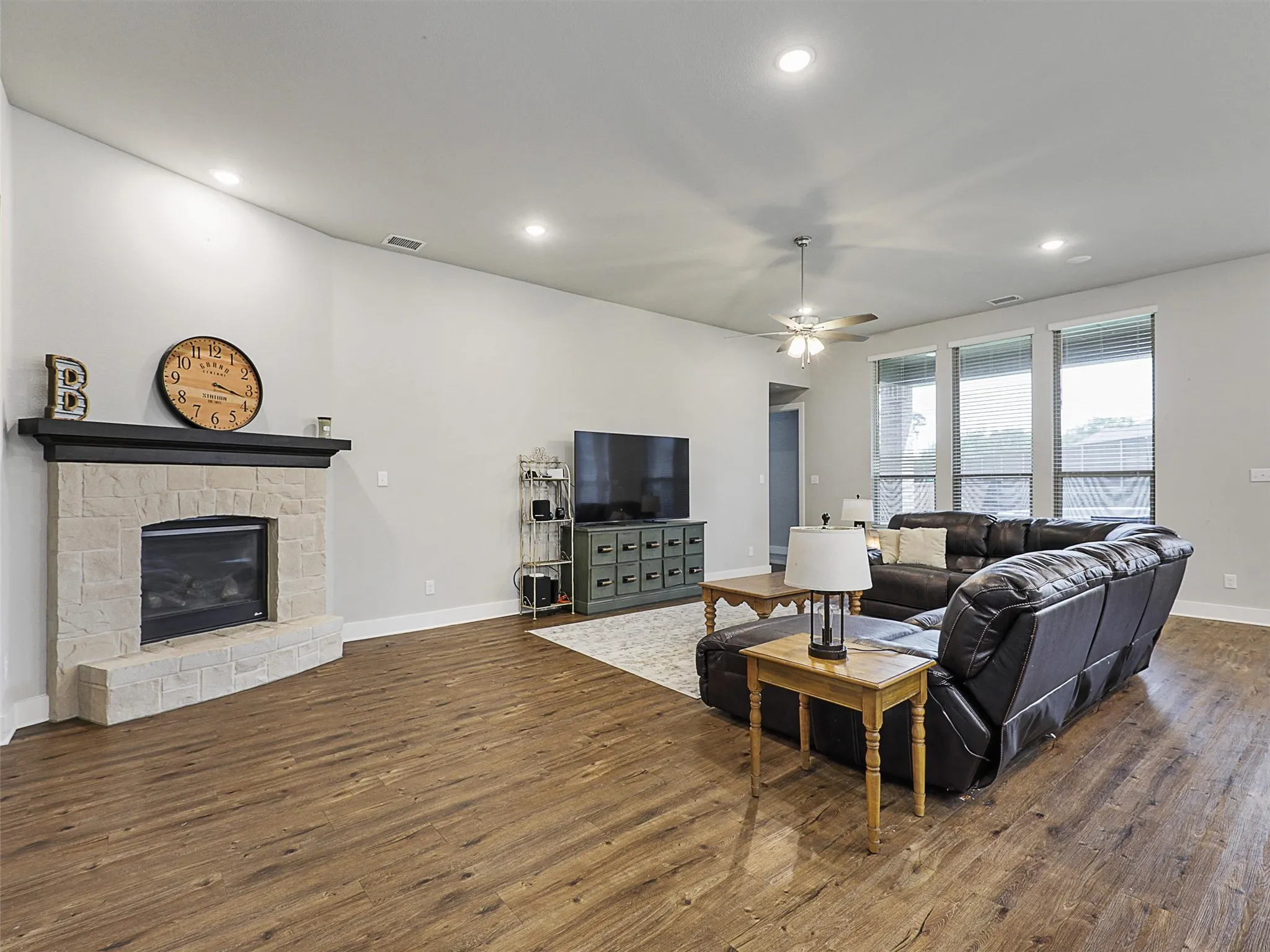Whether you’re hosting family game night or a quiet movie evening, the oversized living room with recessed lighting and backyard views offers the perfect setting.