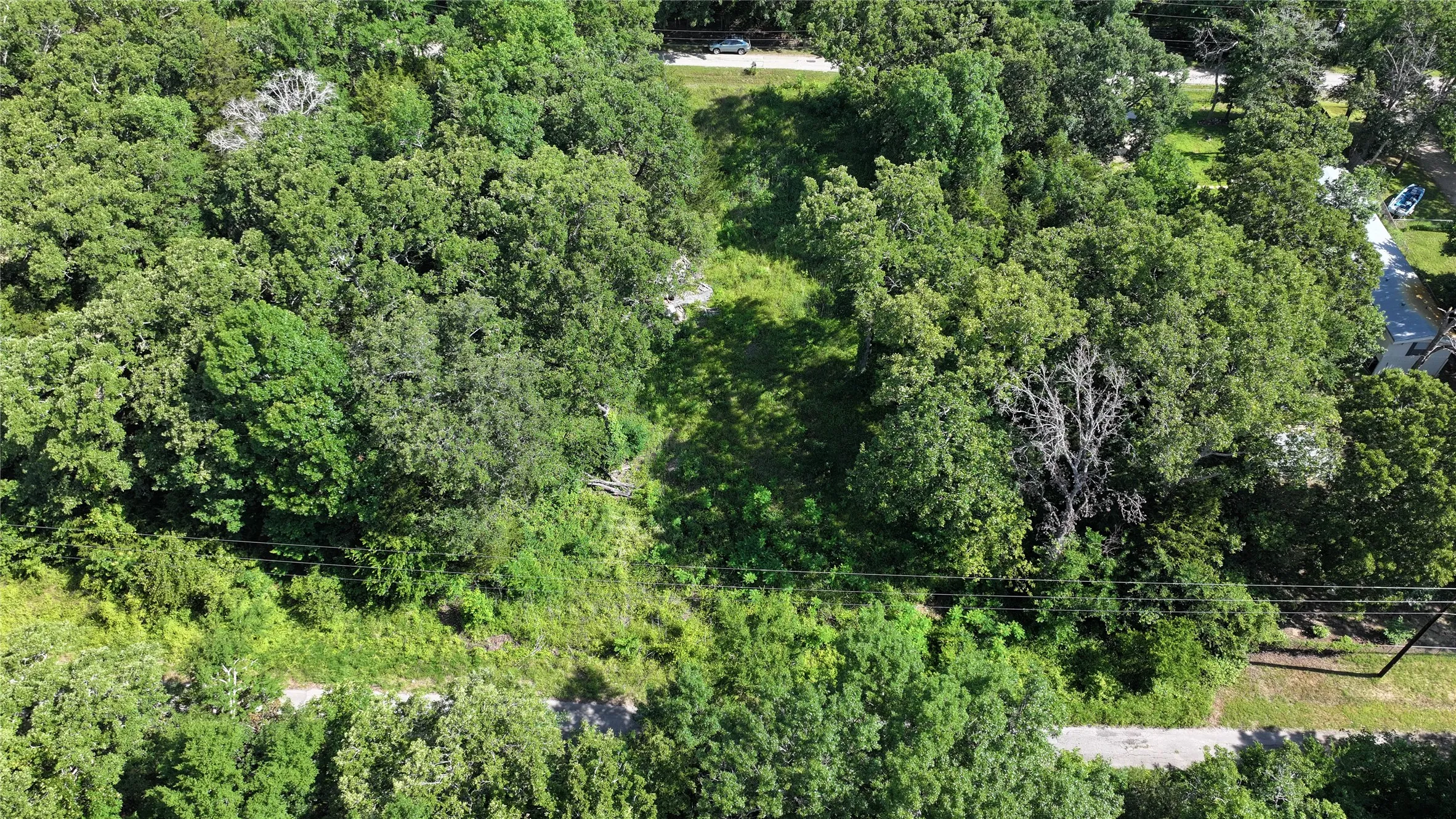 Drone / aerial view of a heavily wooded area