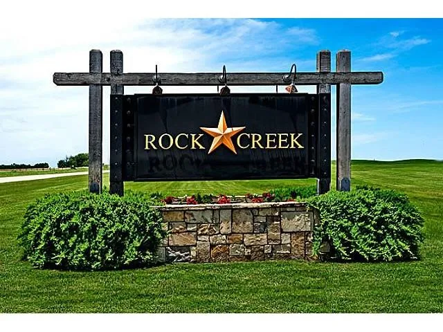 Community sign featuring a yard