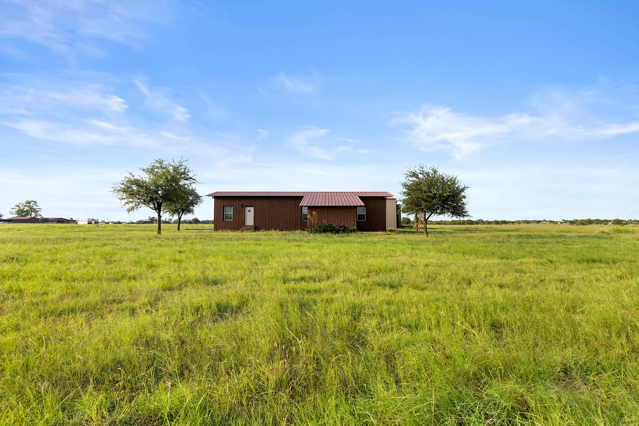 View of yard with a view of countryside, an outbuilding, and an outdoor structure