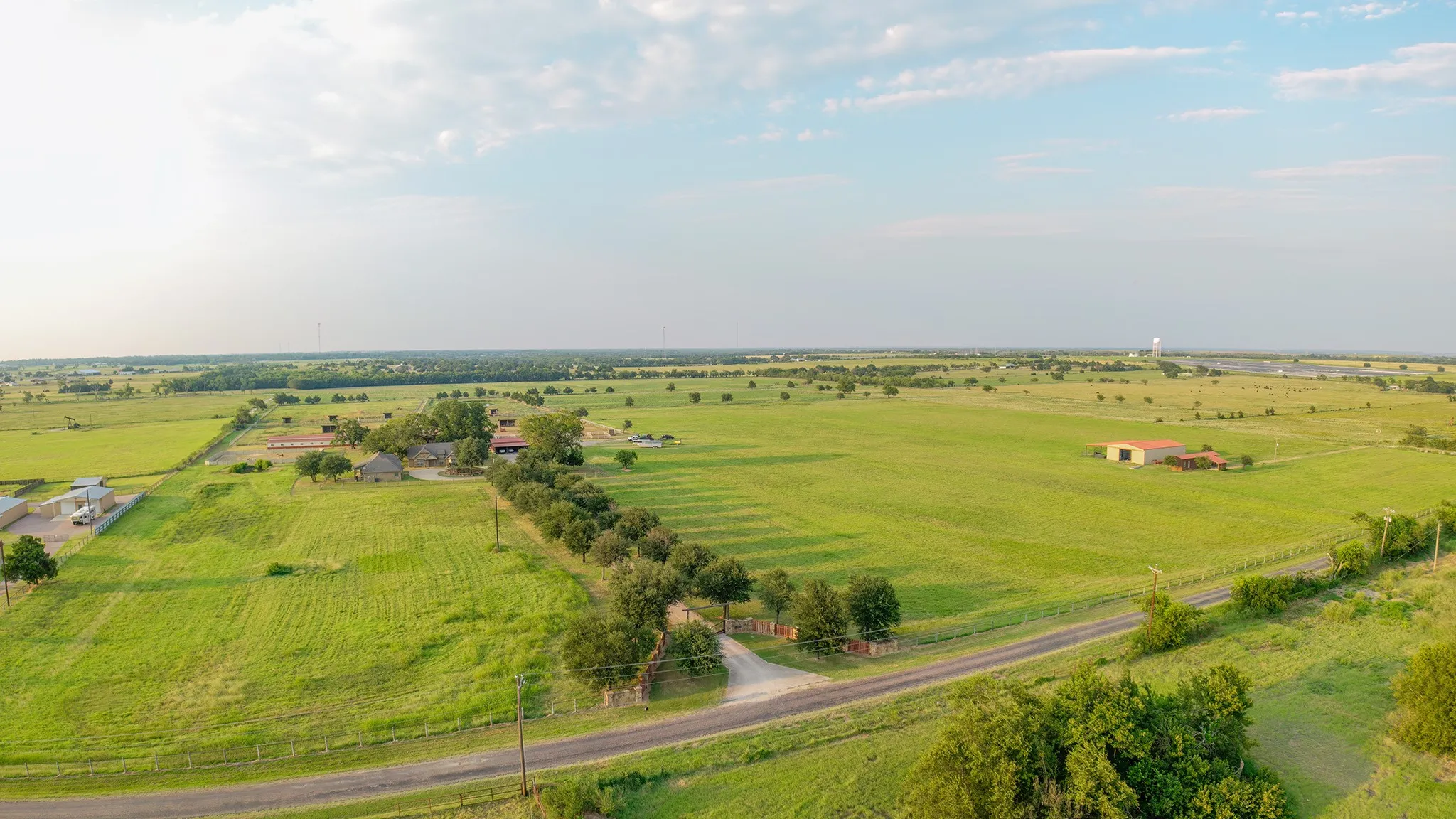 Overview of rural landscape featuring large plots for crops